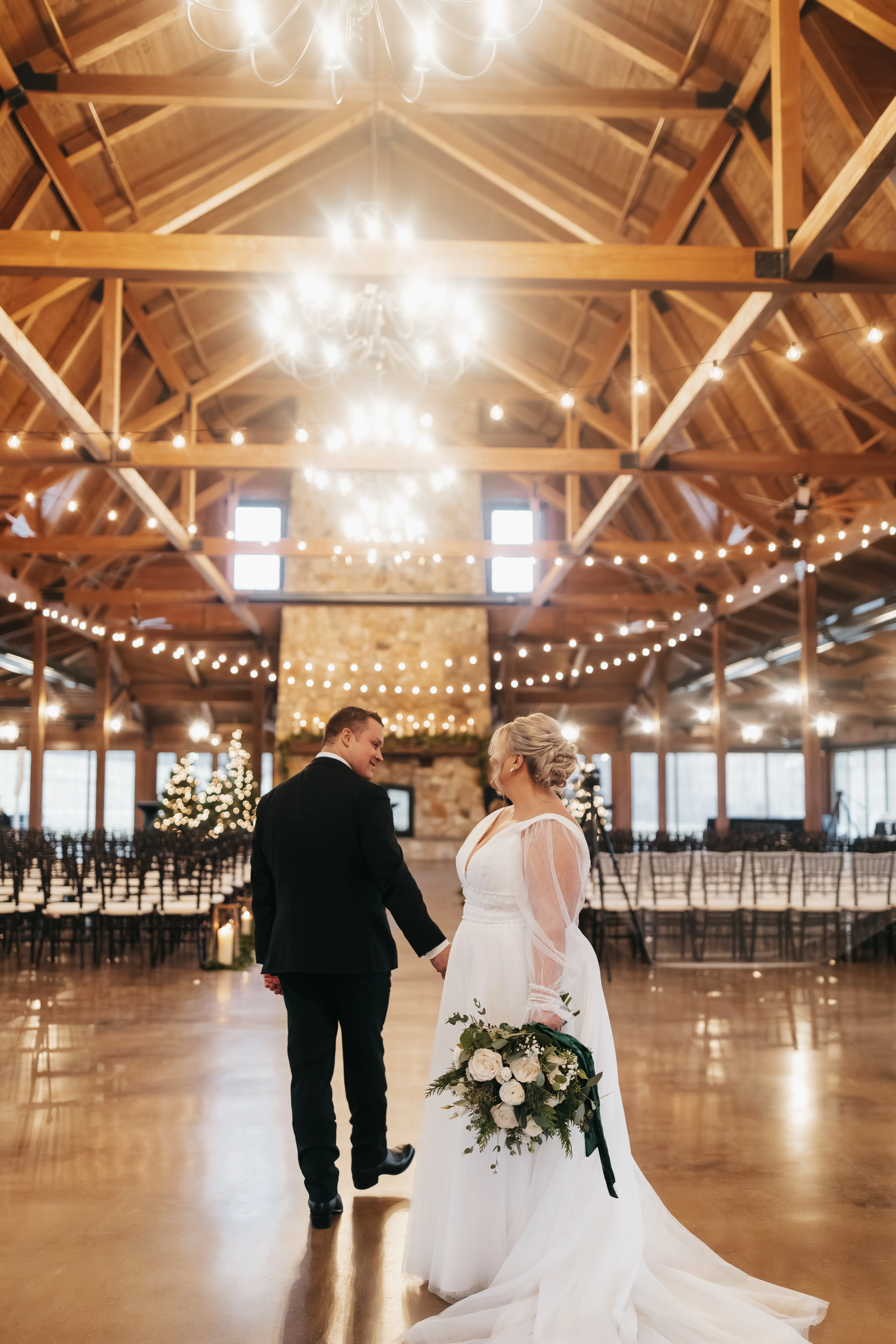 Bride wearing Joanne wedding dress by Rebecca Ingram looking at her husband