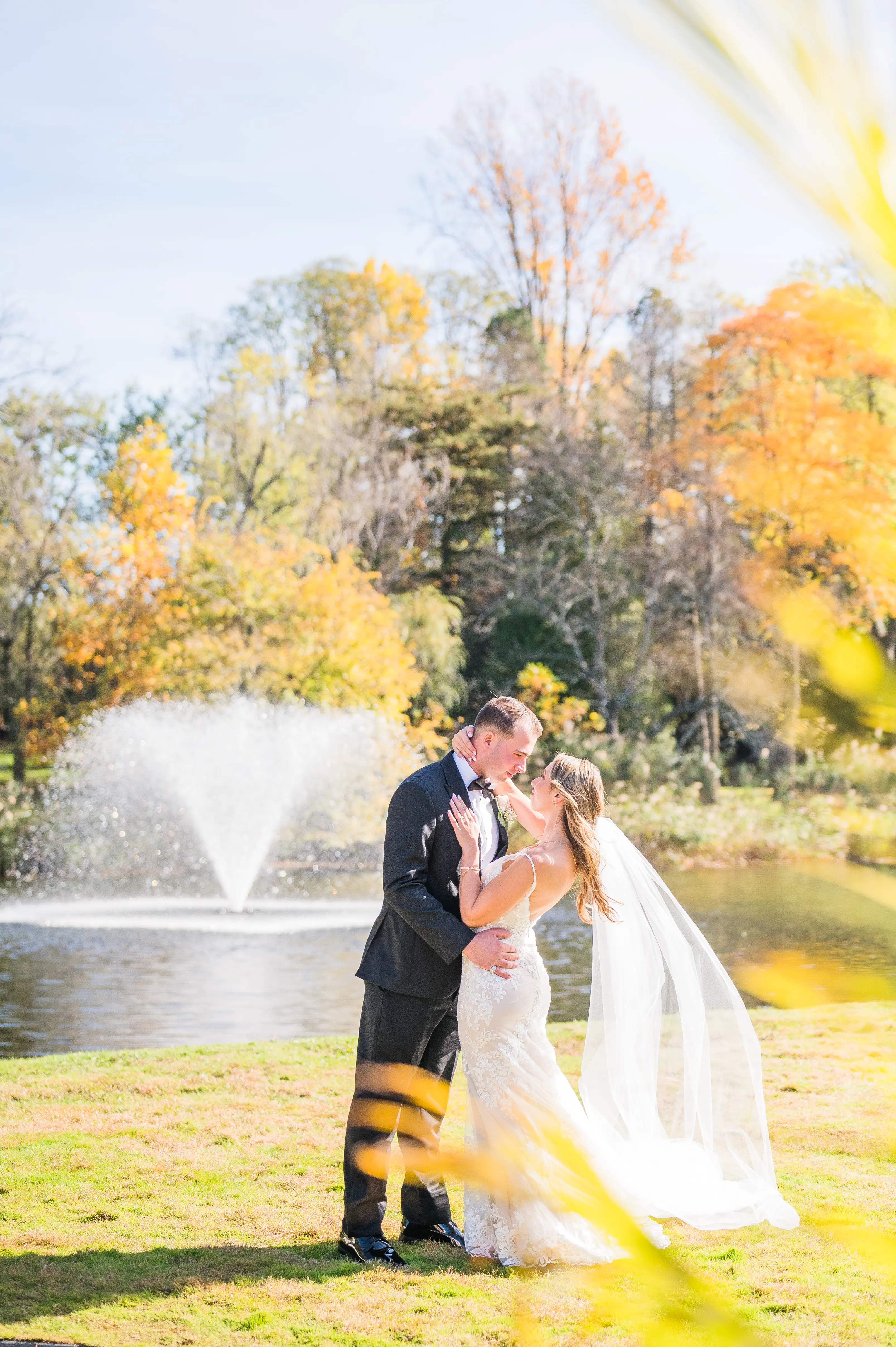 Real bride in sparkly lace fit-and-flare bridal gown with lace motifs over tulle called Fontaine by Maggie Sottero