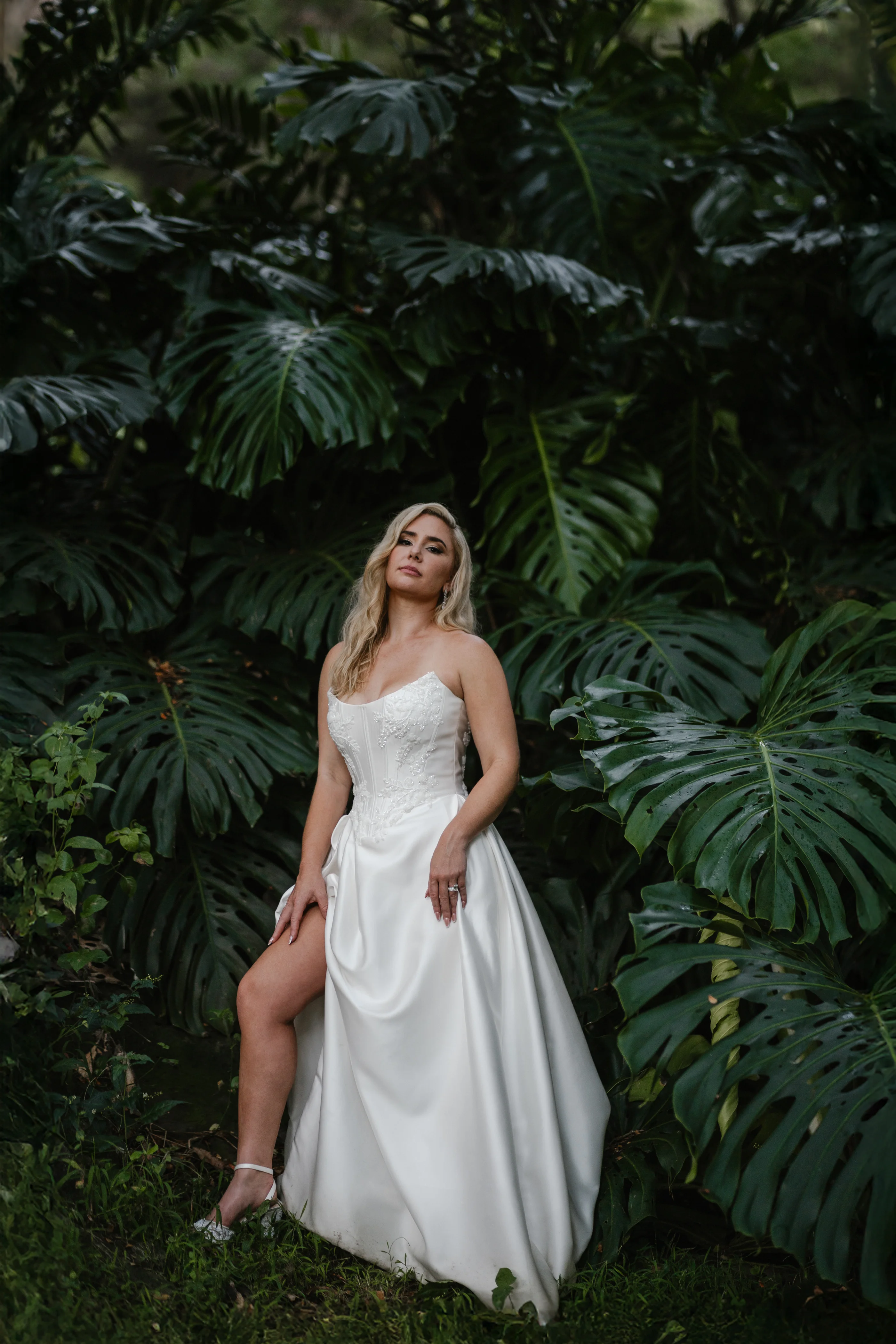 Bride Wearing Sexy Slit Satin Wedding Dress Called Amadora By Sottero And Midgley In Jungle Foliage