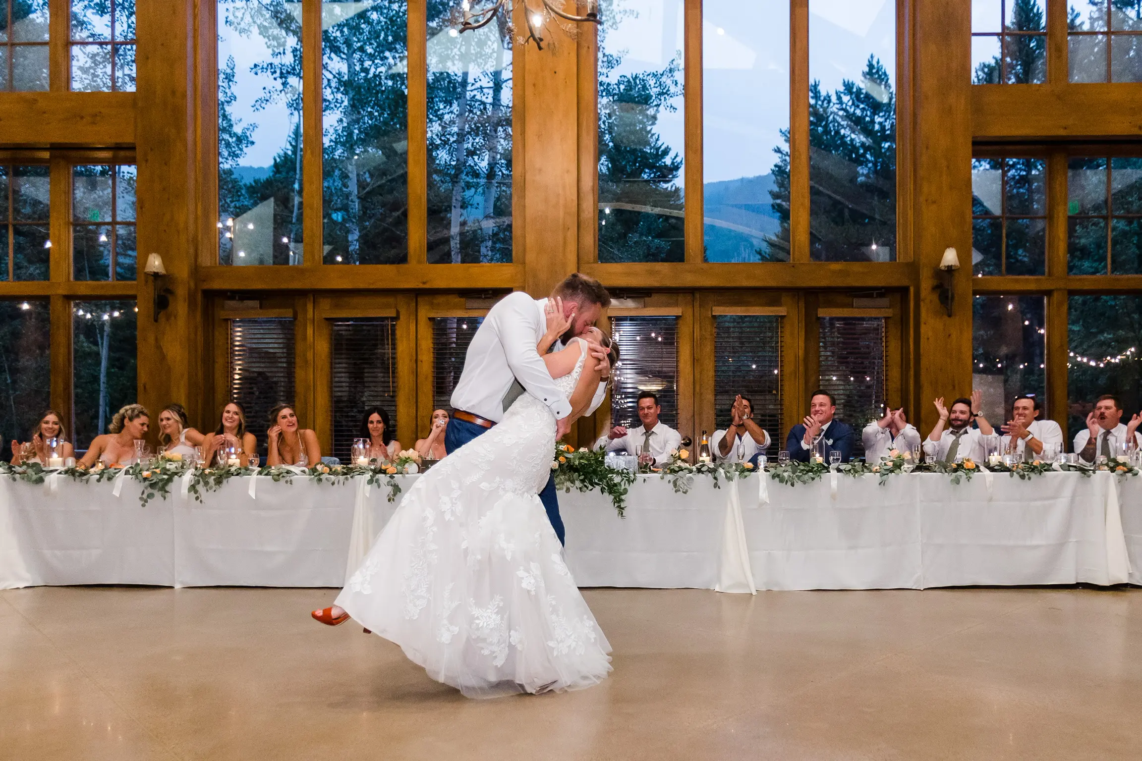 Groom dipping his bride during their first dance as a married couple.