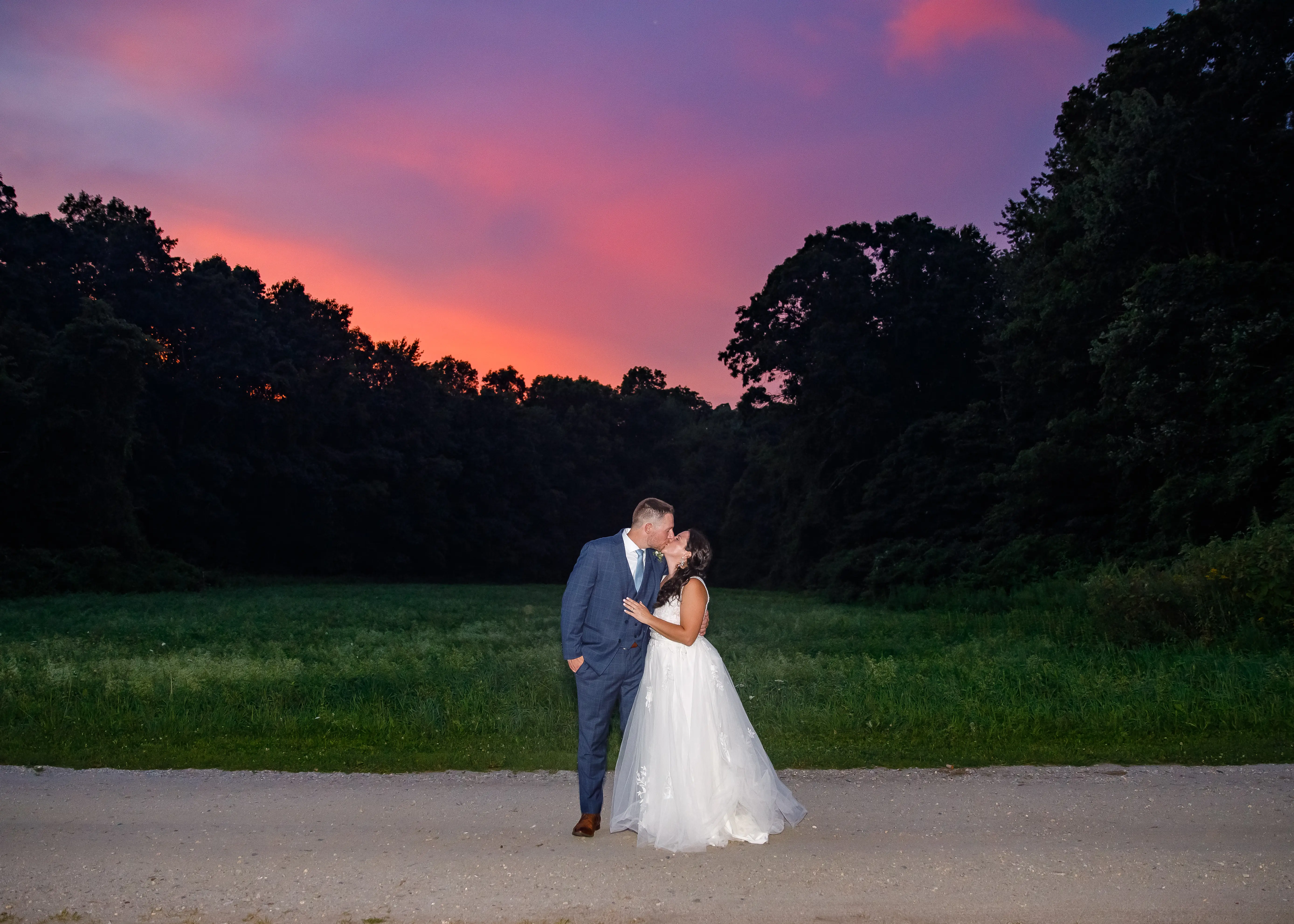 Groom With Bride Wearing Lace A-Line Wedding Dress Raelynn By Rebecca Ingram