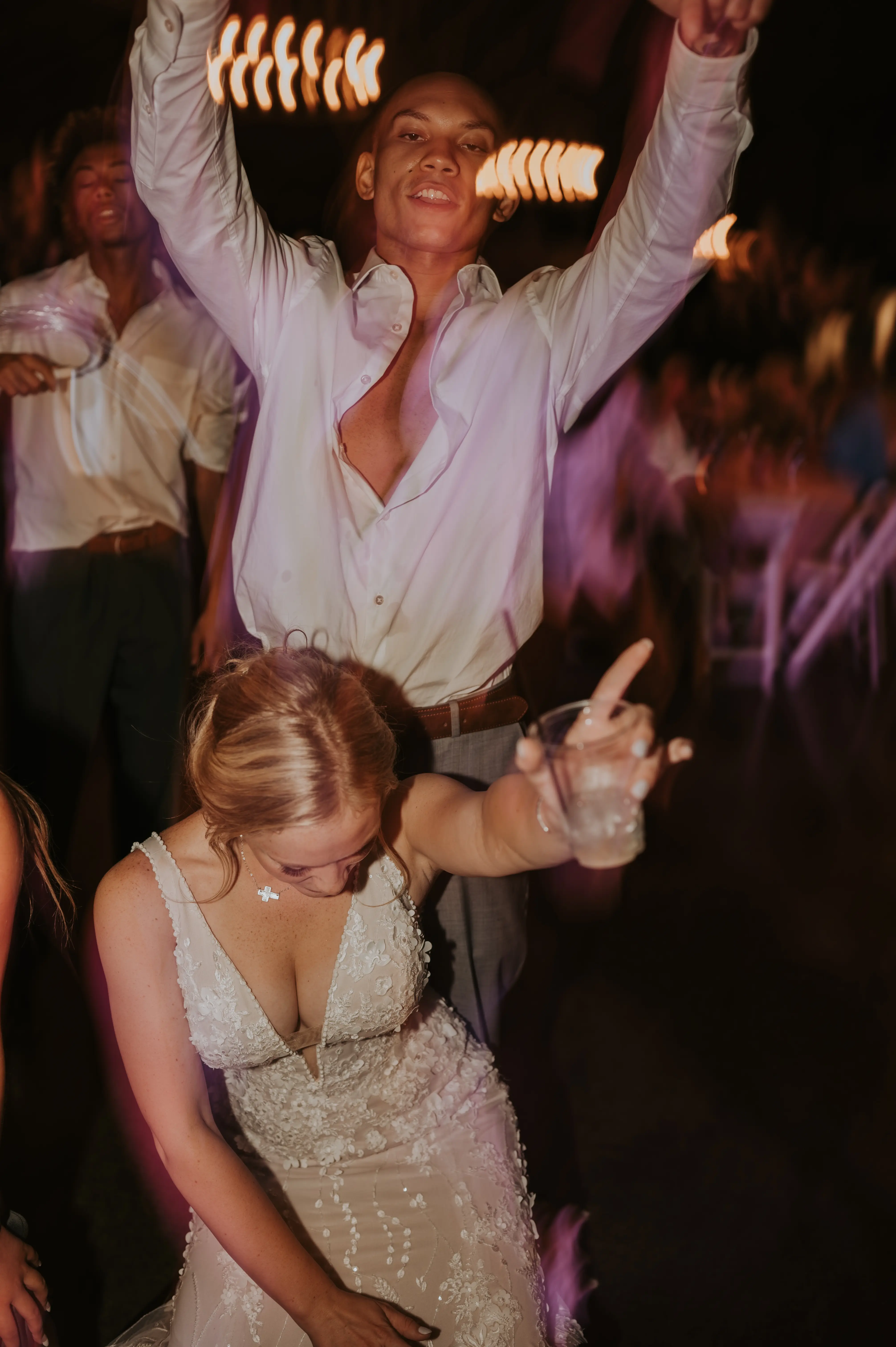 Groom Dancing with Bride in Mermaid Wedding Dress with 3-D Floral Motifs and Extended Scalloped Lace Train Called Cruz by Sottero & Midgley