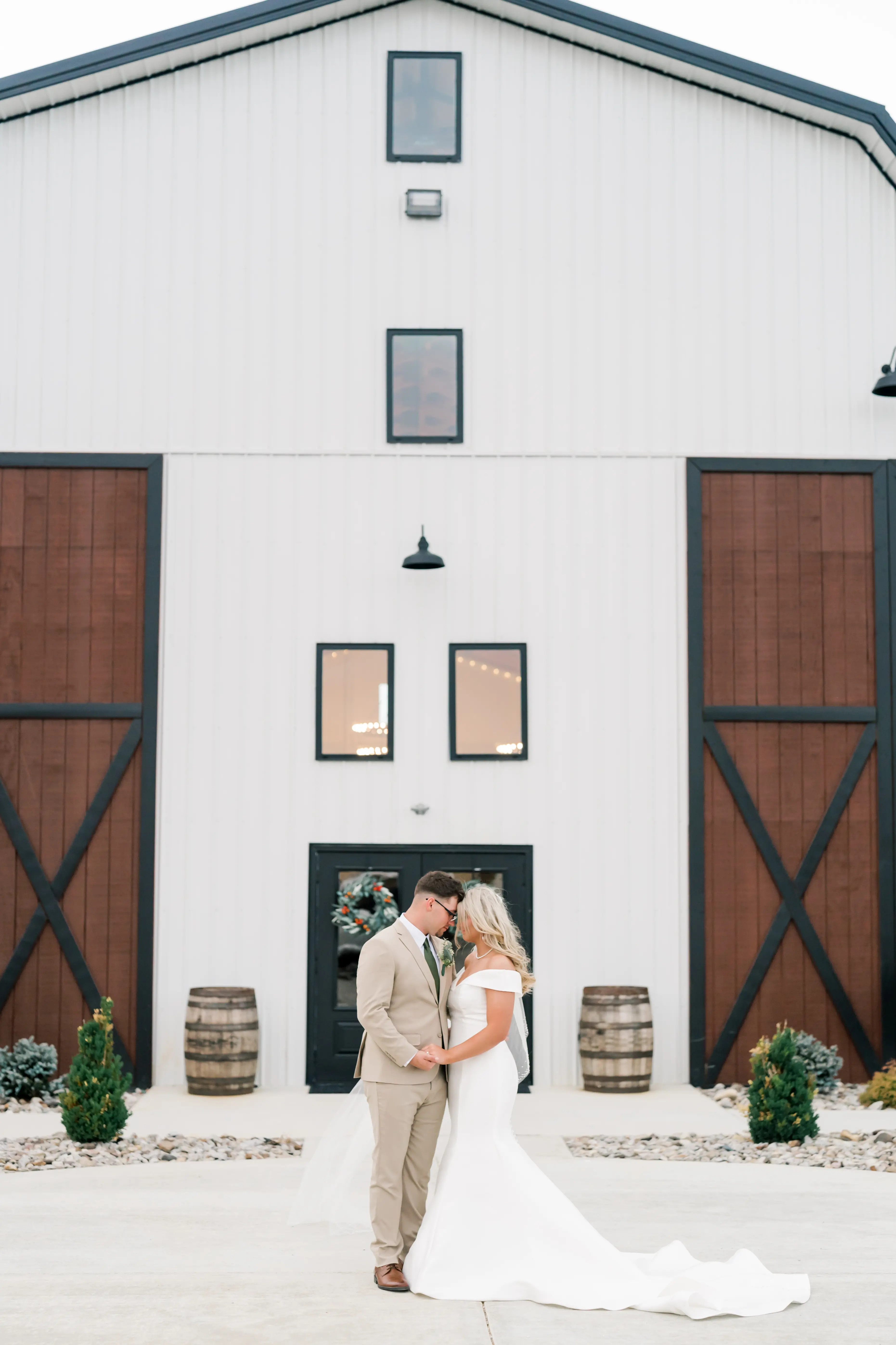 Bride wearing Josie wedding dress by Rebecca Ingram with her husband