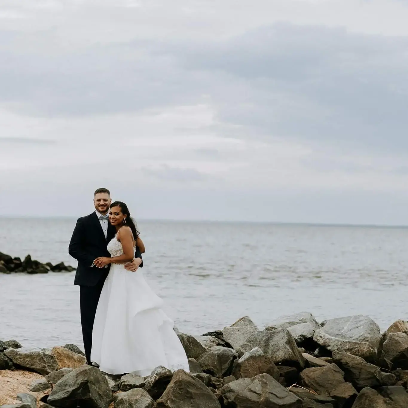 Groom and Bride at a Beach Wedding Wearing Lace Aline Wedding Dress called Savannah by Maggie Sottero