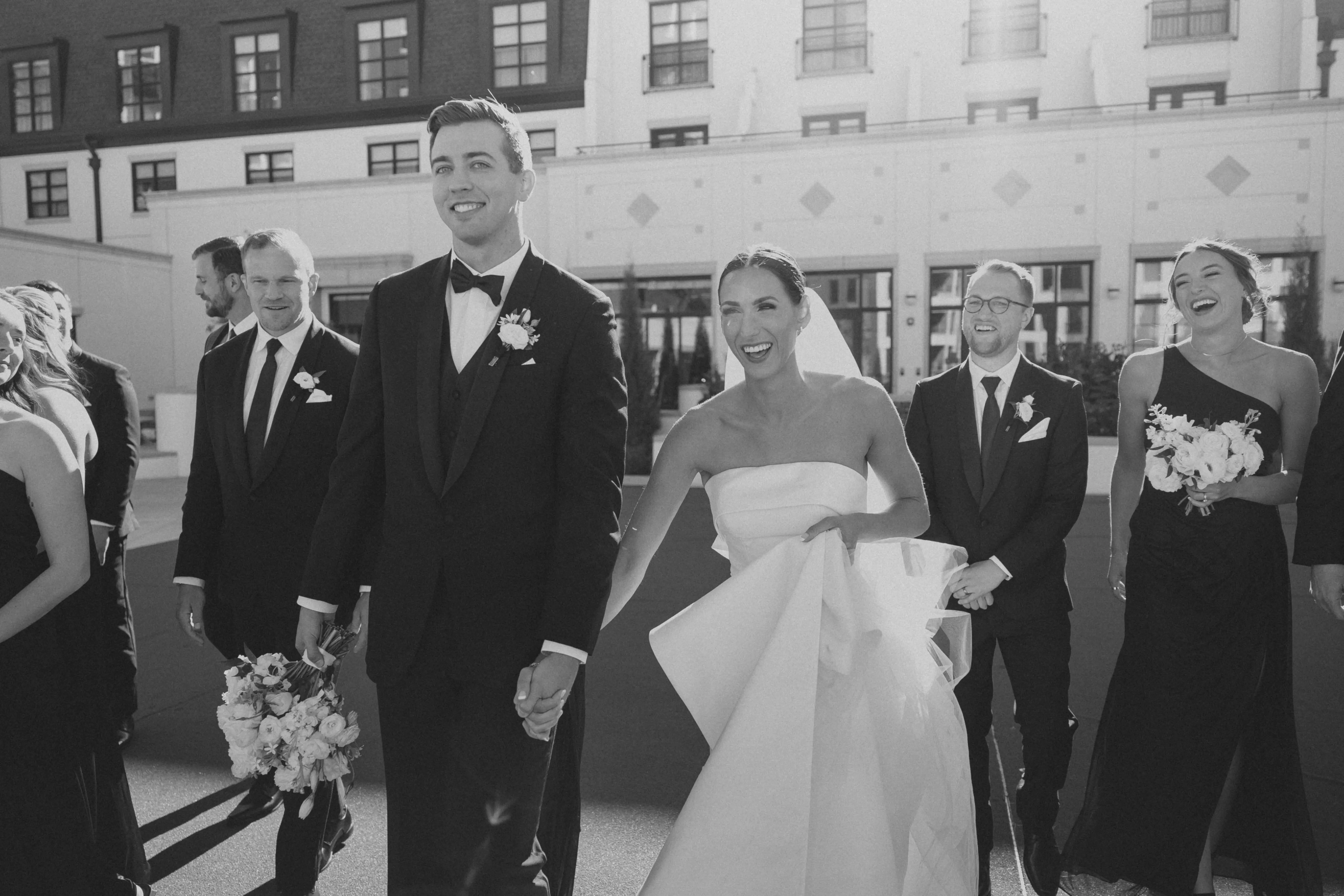 Bride wearing Mitchell wedding dress by Maggie Sottero with the wedding party