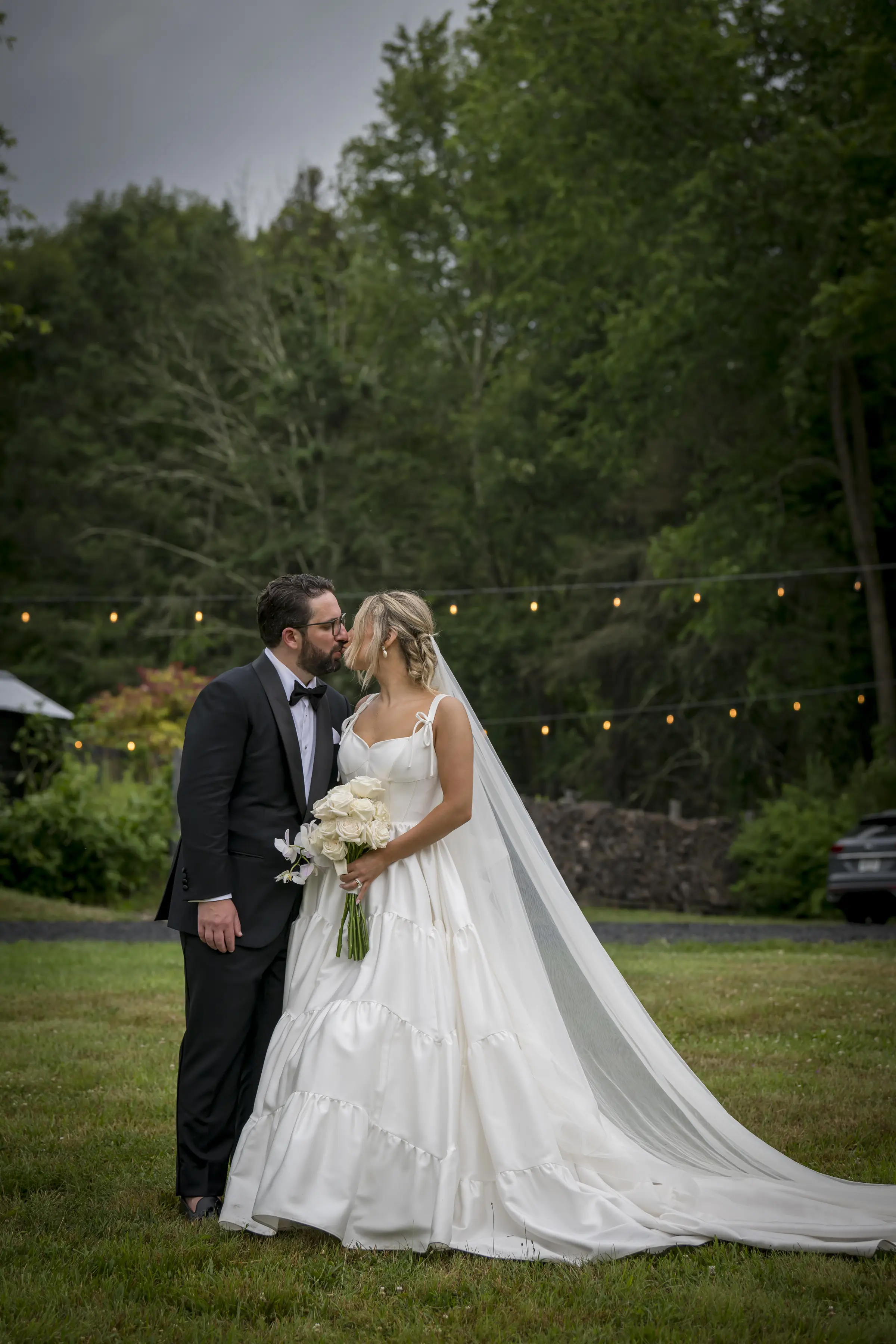 Bride wearing Talitha by Sottero and Midgley kissing her husband