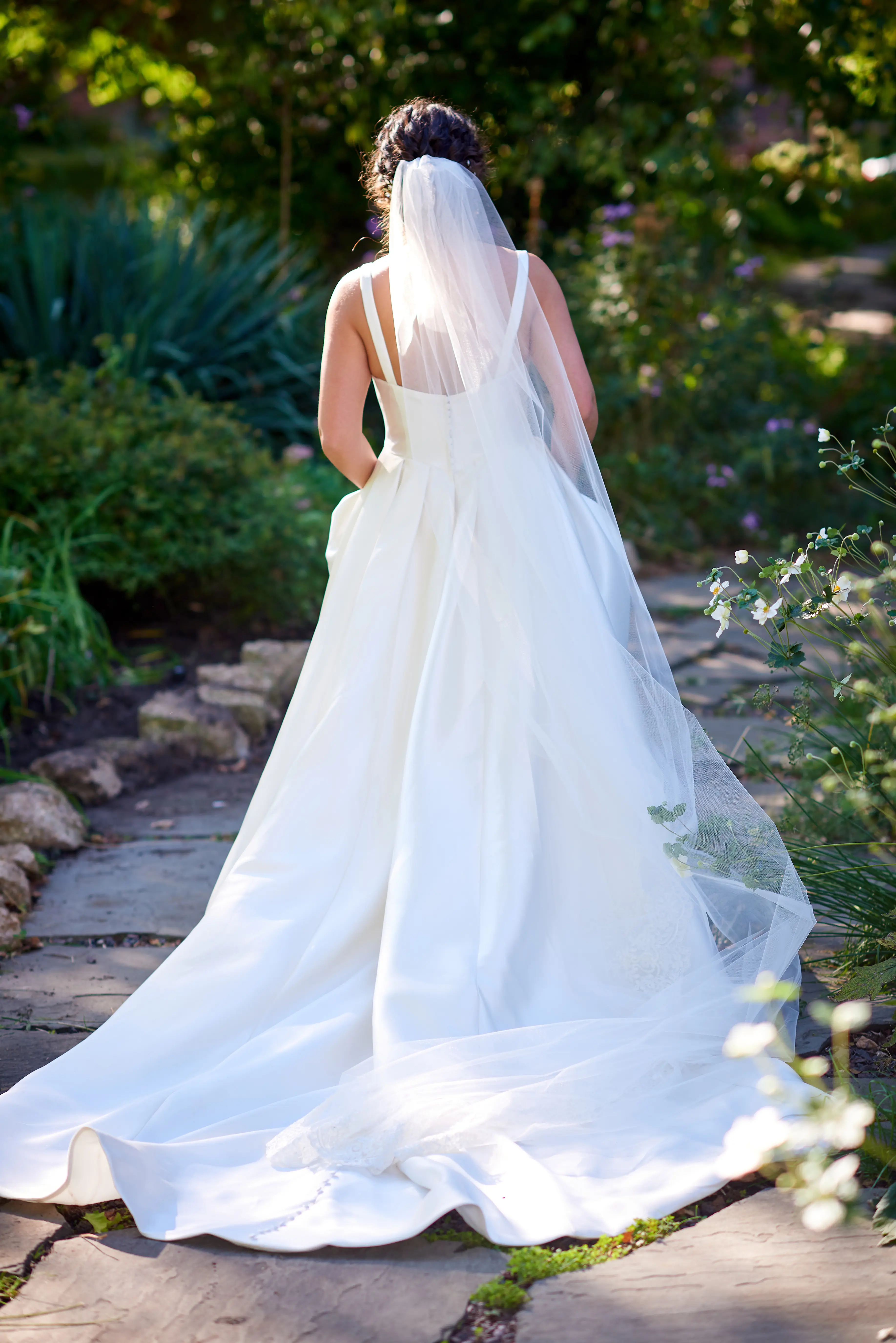 Bride Wearing Simple A-Line Bridal Gown Called Selena By Maggie Sottero In A Garden