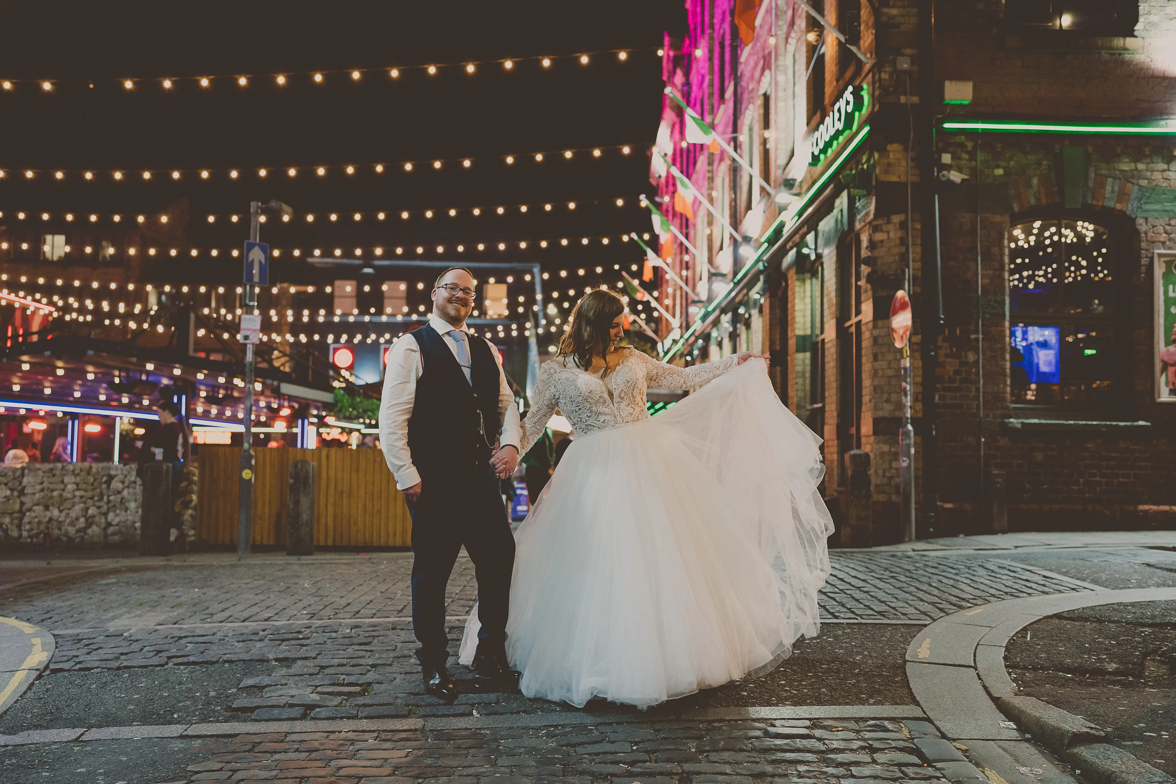 Bride And Groom Together. Bride Wearing Lace Long Sleeve Ball Gown Wedding Dress With Tulle Skirt Called Mallory Dawn By Maggie Sottero