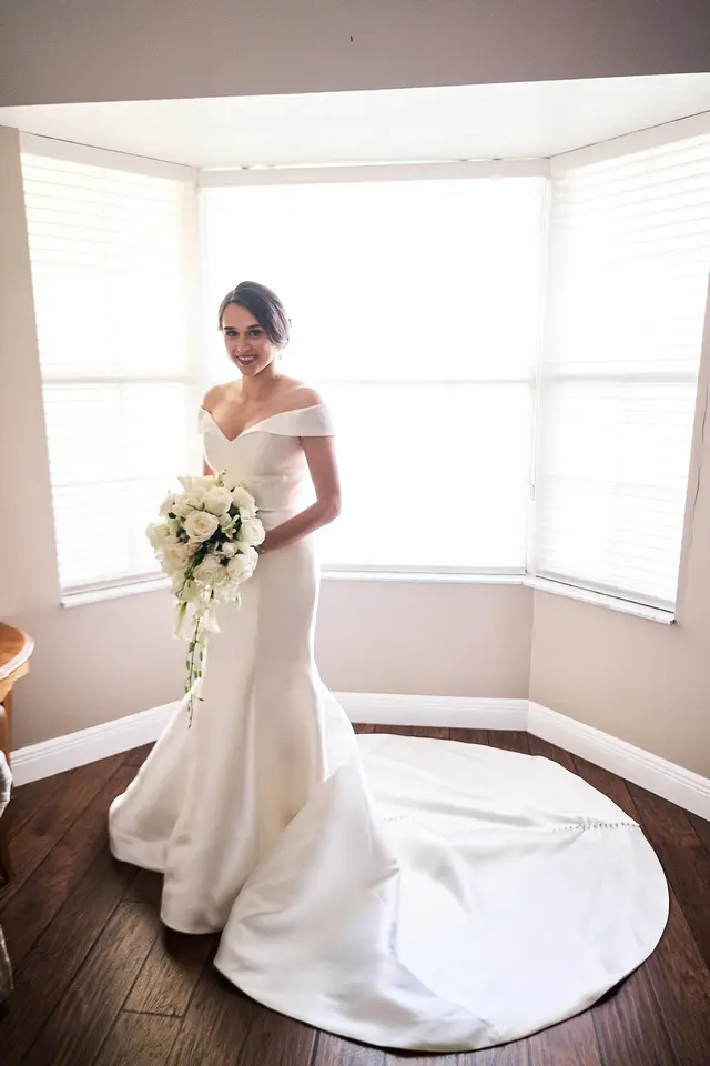 bride in off the shoulder elegant wedding dress