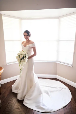bride in off the shoulder elegant wedding dress