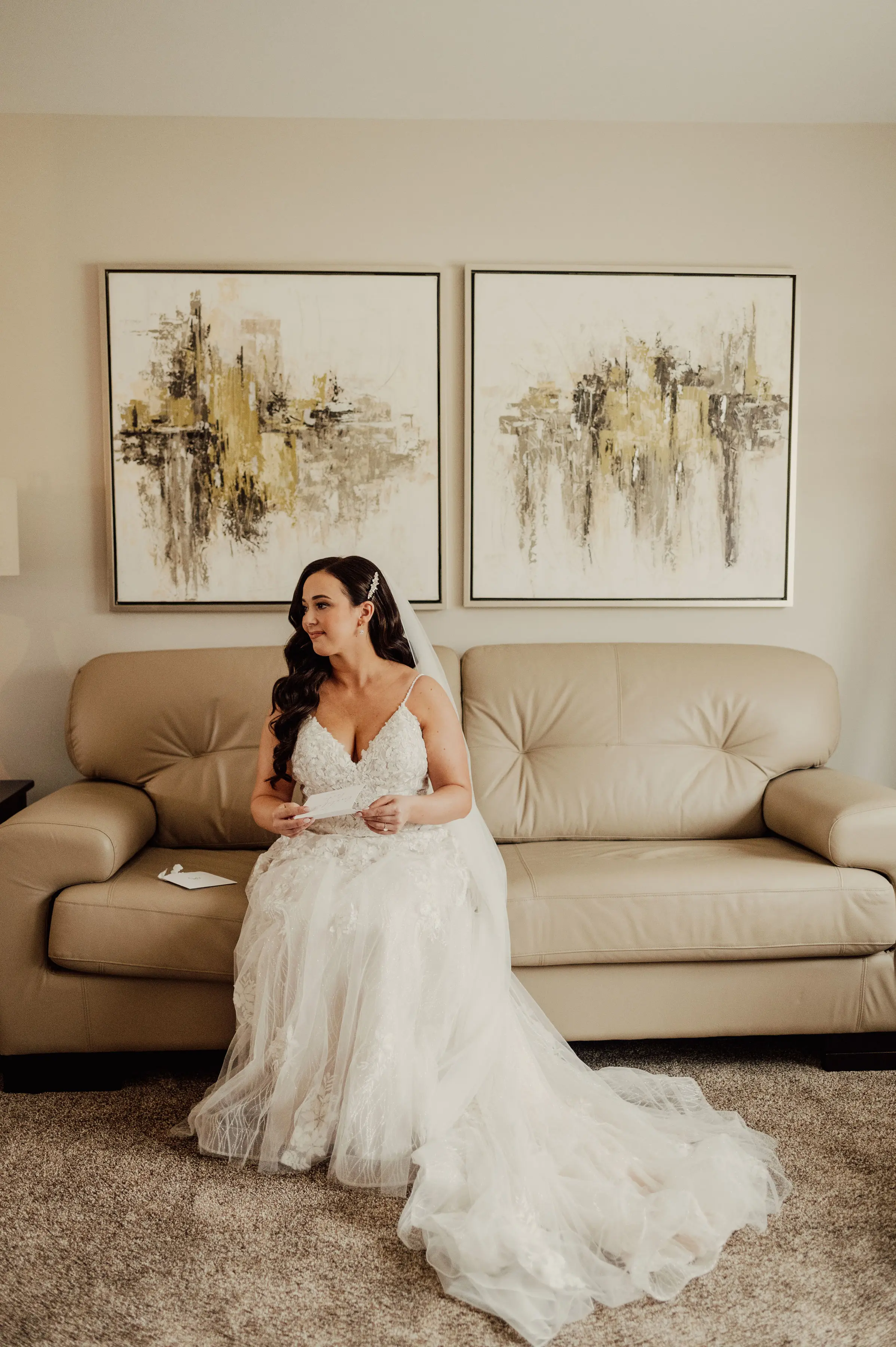 Bride Wearing Floral Lace Wedding Gown Called Laramie By Sottero And Midgley Sitting On A Couch