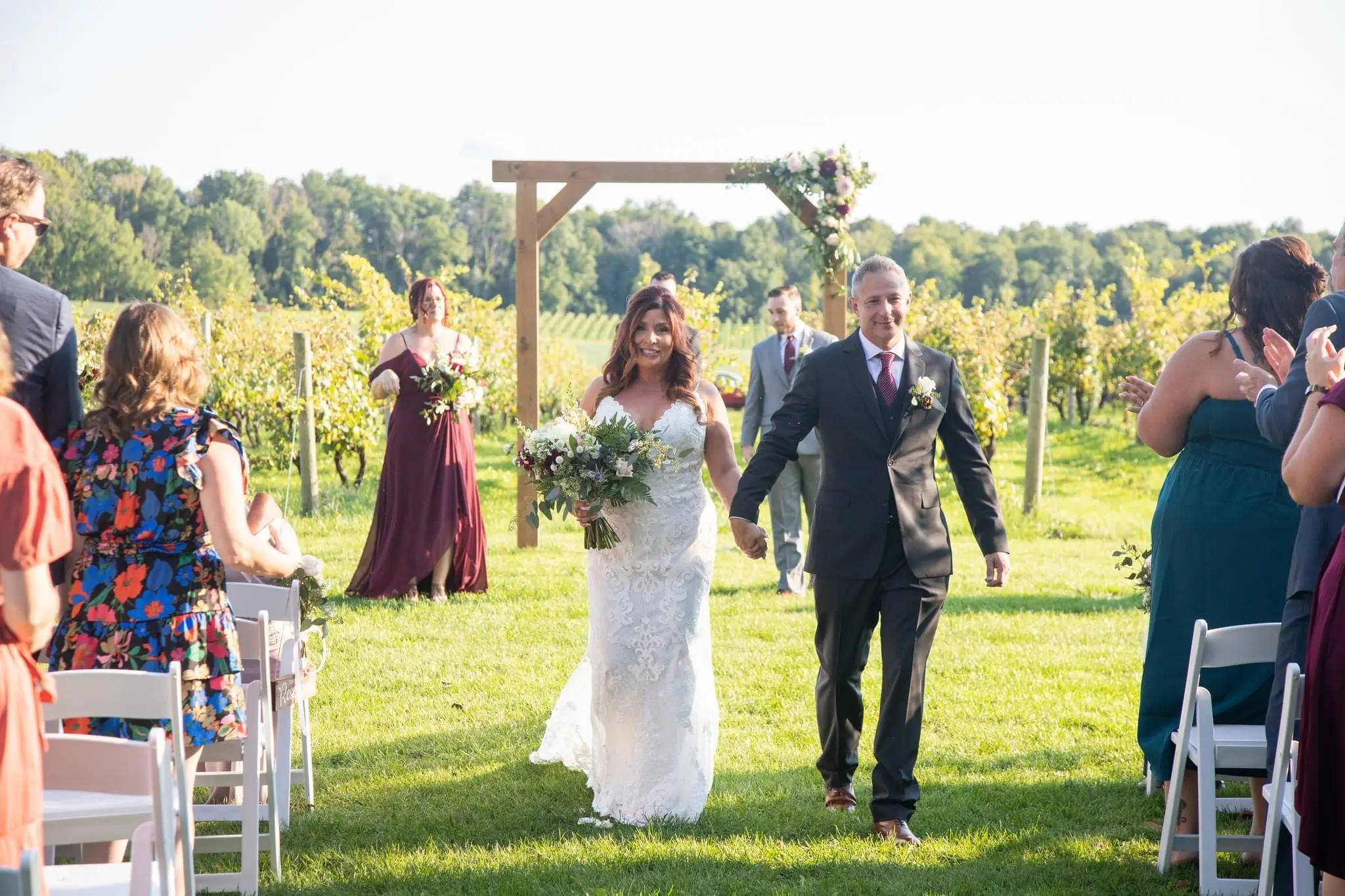Bride Wearing Sexy Mermaid Wedding Dress Called Tuscany By Maggie Sottero Walking With Groom At Marriage Ceremony