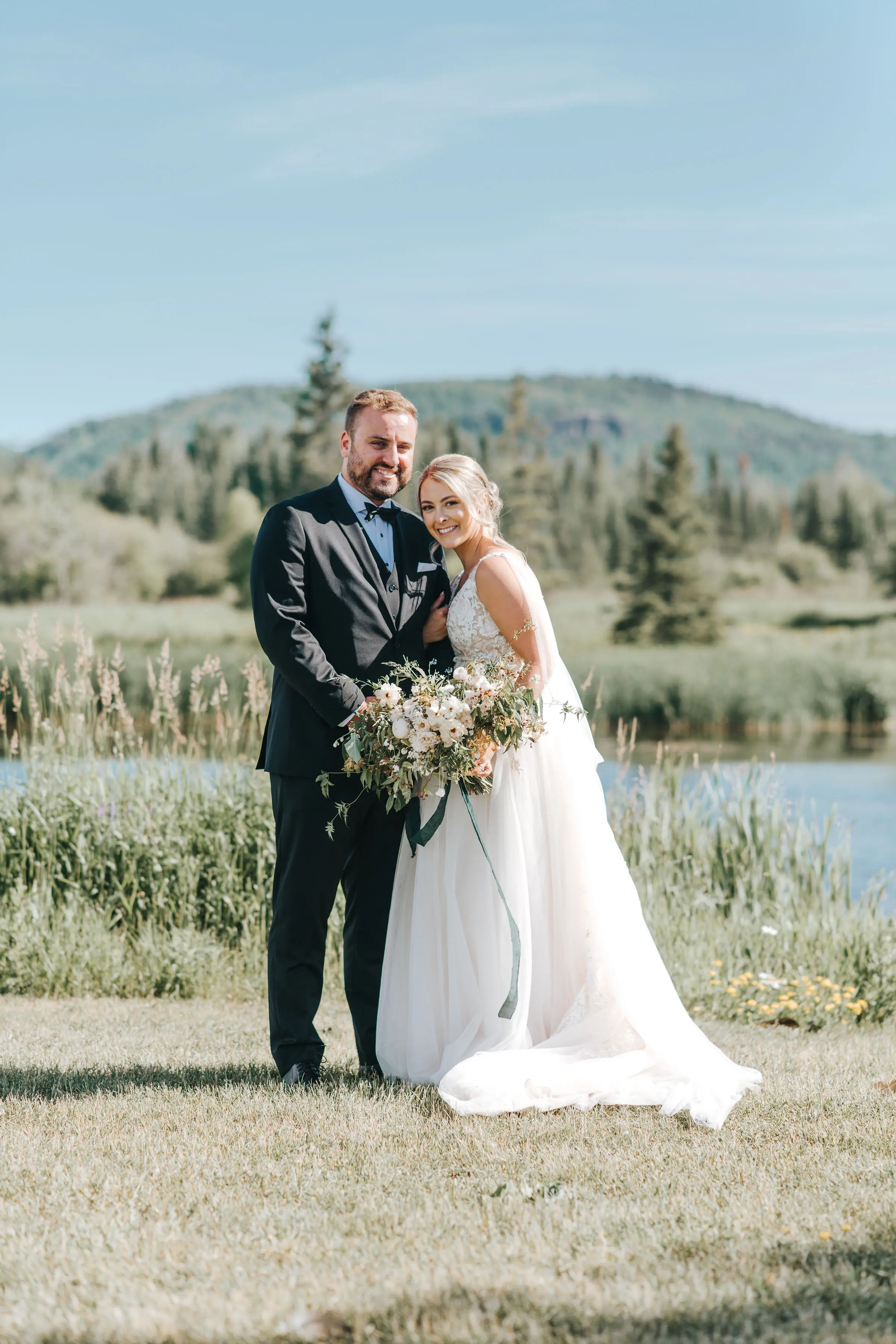 Groom With Bride Wearing V-Neck A-Line Wedding Dress Minerva By Rebecca Ingram