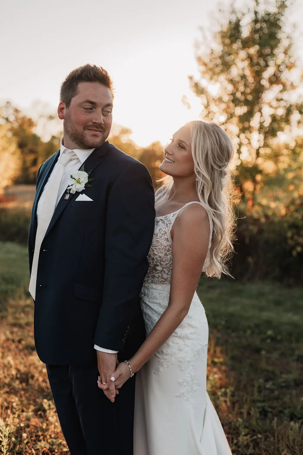Bride peeking over her groom's shoulder.