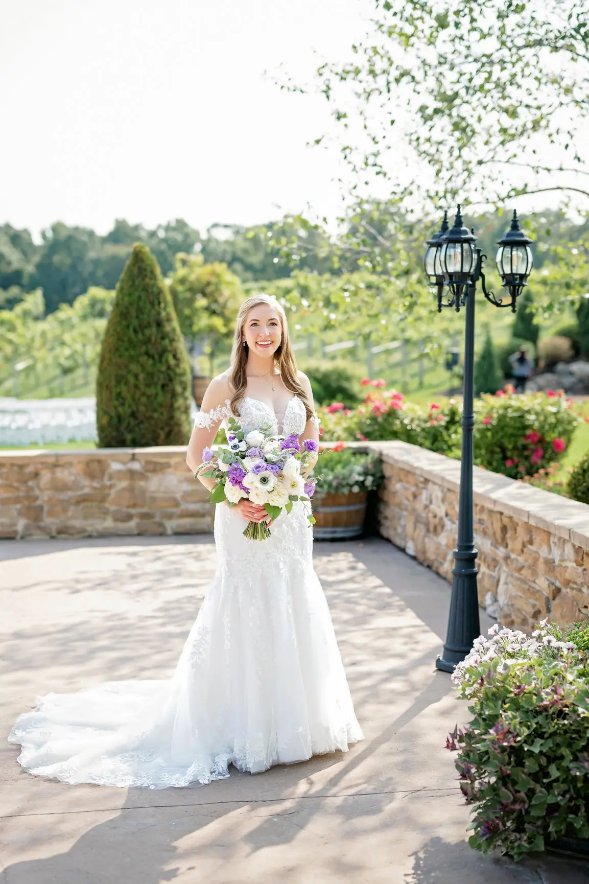 Bride Wearing Lace Wedding Dress Called Lennon By Maggie Sottero Next To A Lamppost