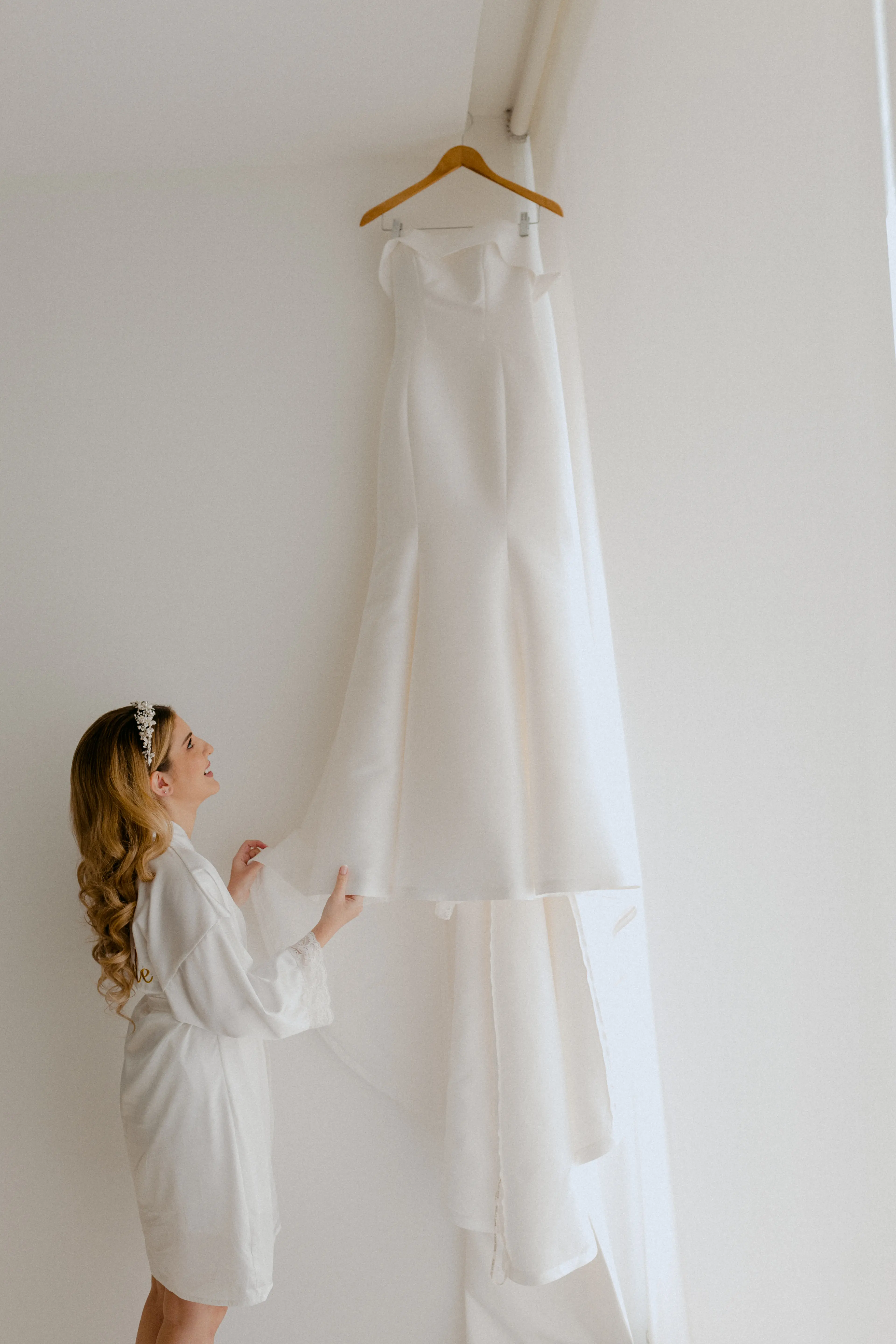 Bride Looking At Wedding Dress Mitchell by Maggie Sottero