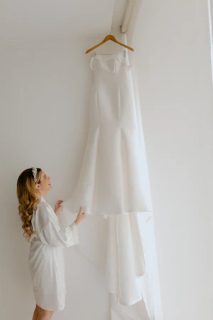 Bride Looking At Wedding Dress Mitchell by Maggie Sottero