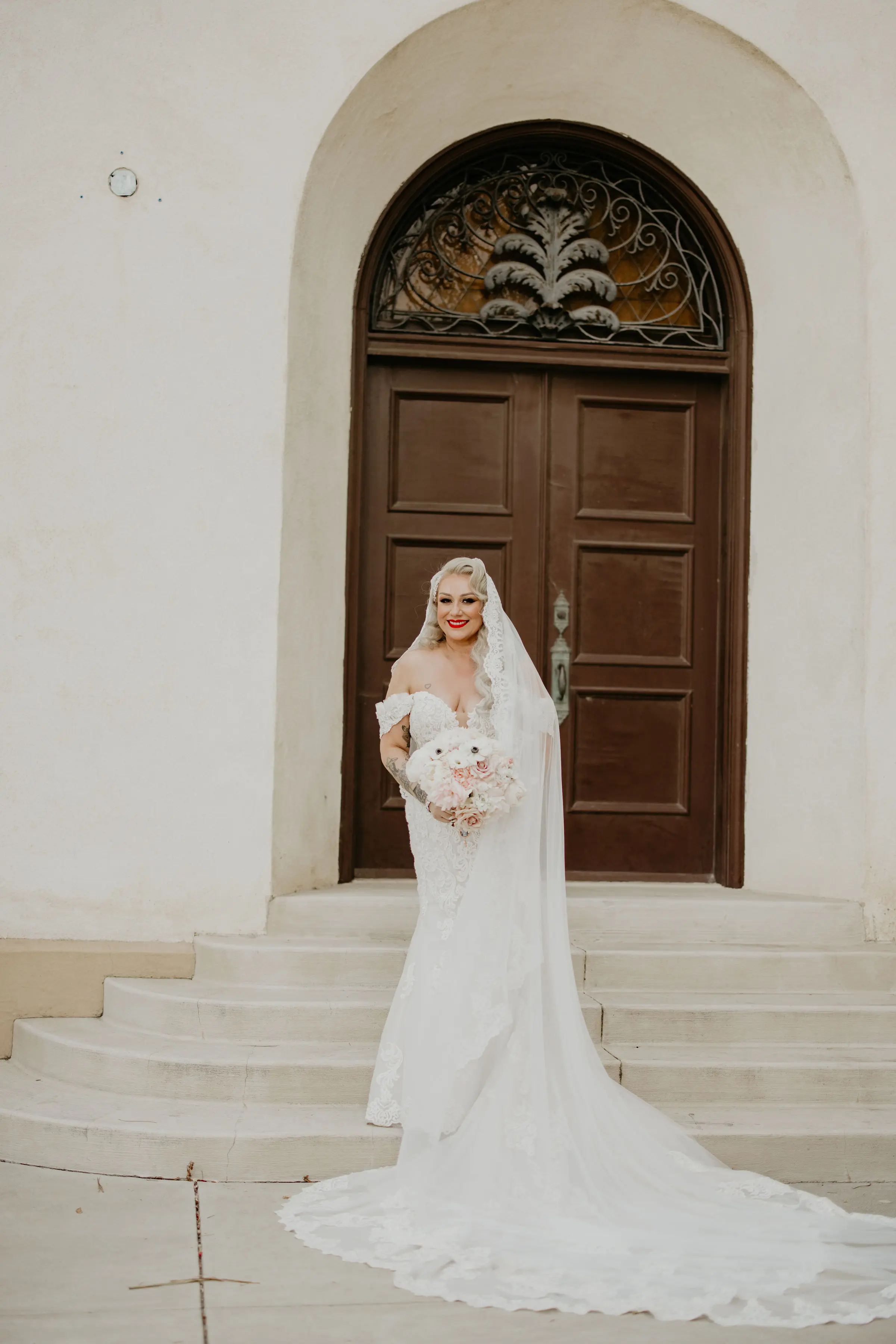 Bride Wearing Sexy Lace Wedding Dress Called Fiona By Maggie Sottero With Veil And Bouquet
