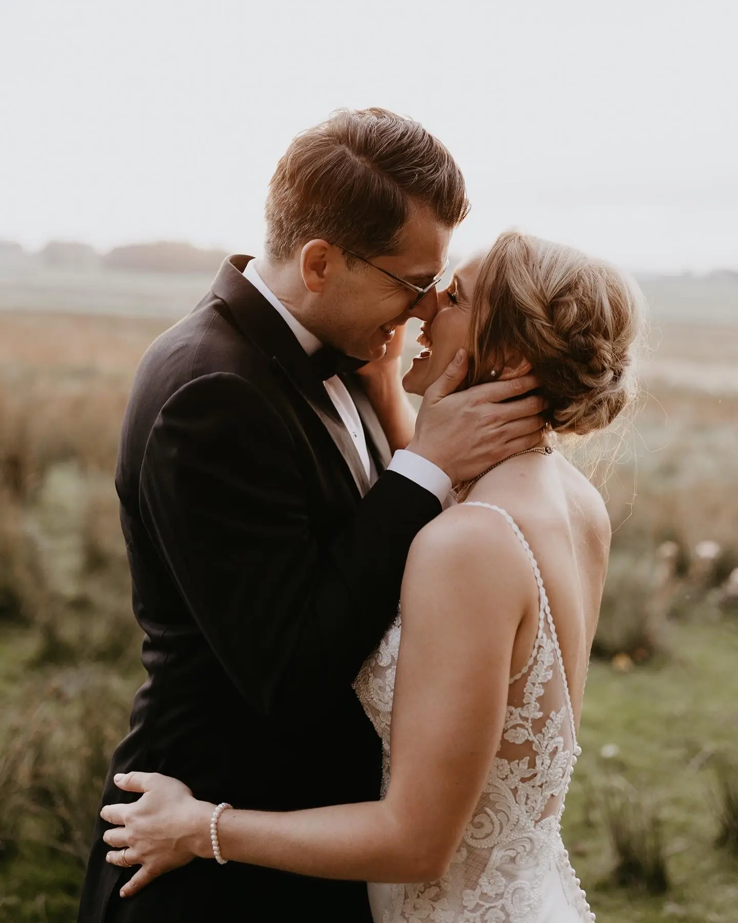Bride Wearing Lace Mermaid Wedding Dress Called Nikki By Maggie Sottero Kissing Groom