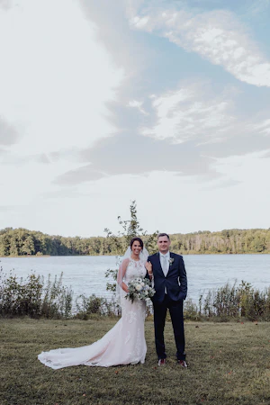 Bride with groom wearing budget friendly fit and flare wedding dress