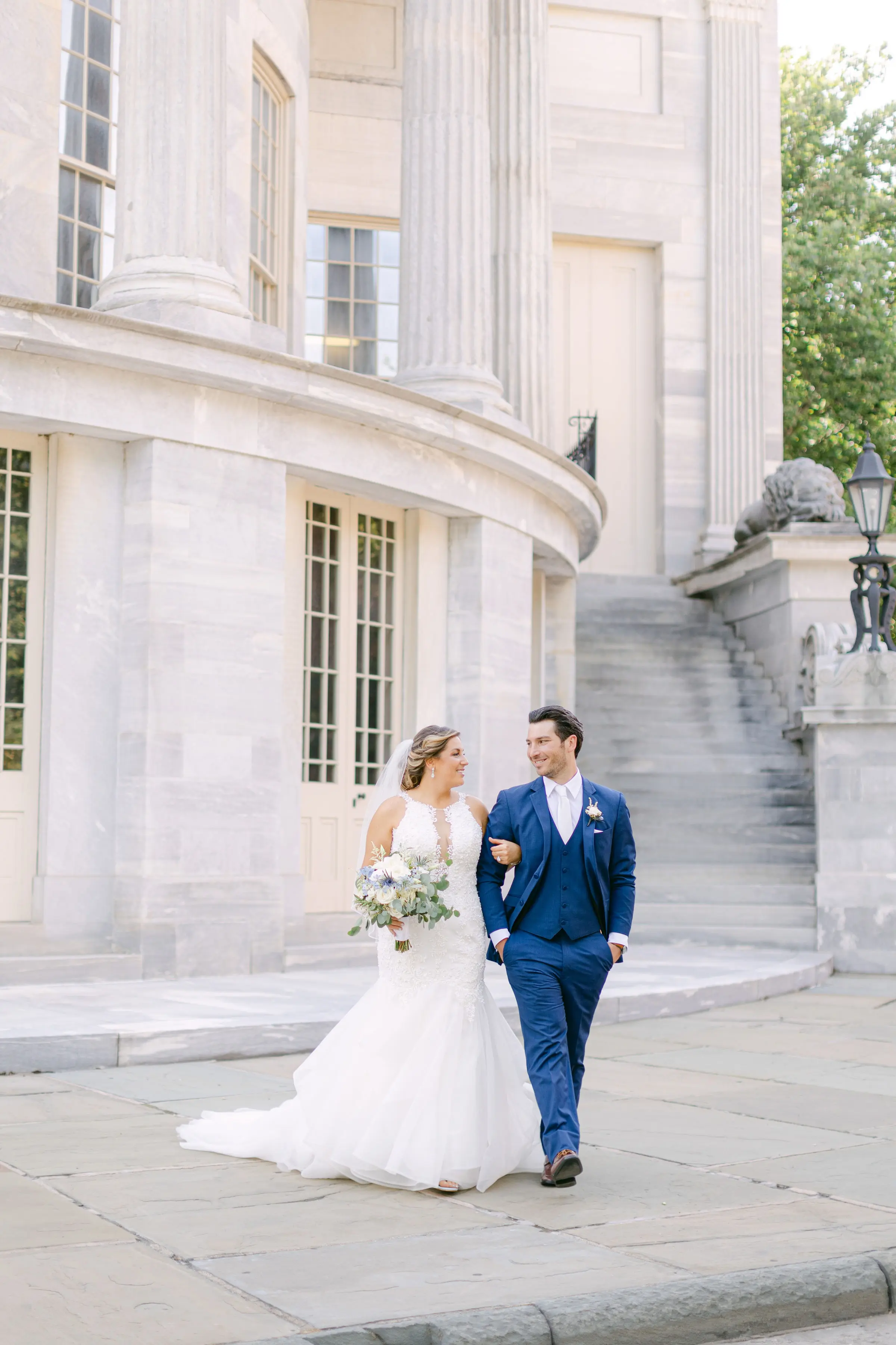 bride with groom wearing organza mermaid wedding dress