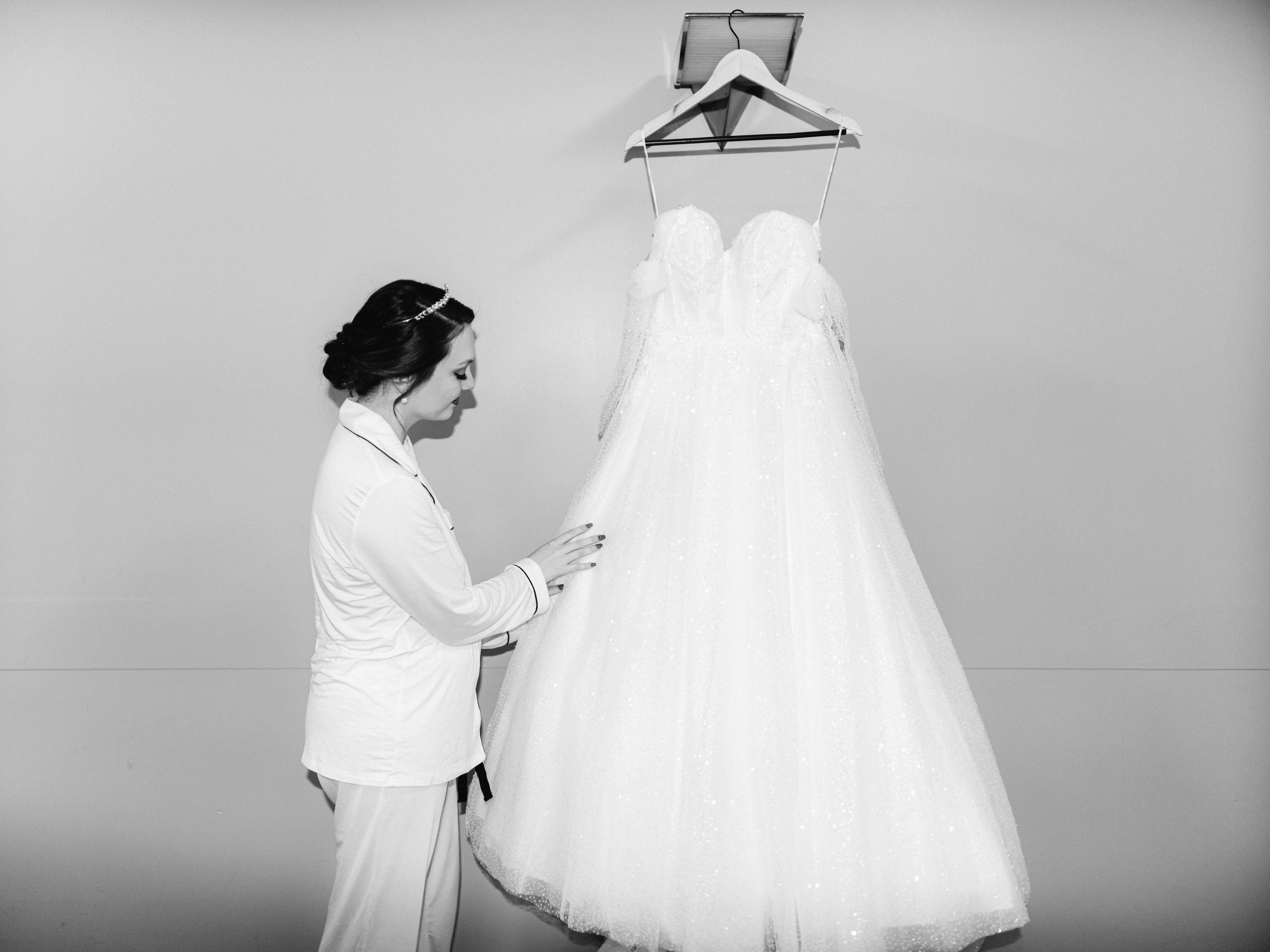 Bride Admiring Her Princess Ballgown Wedding Dress called Shasta by Sottero and Midgley