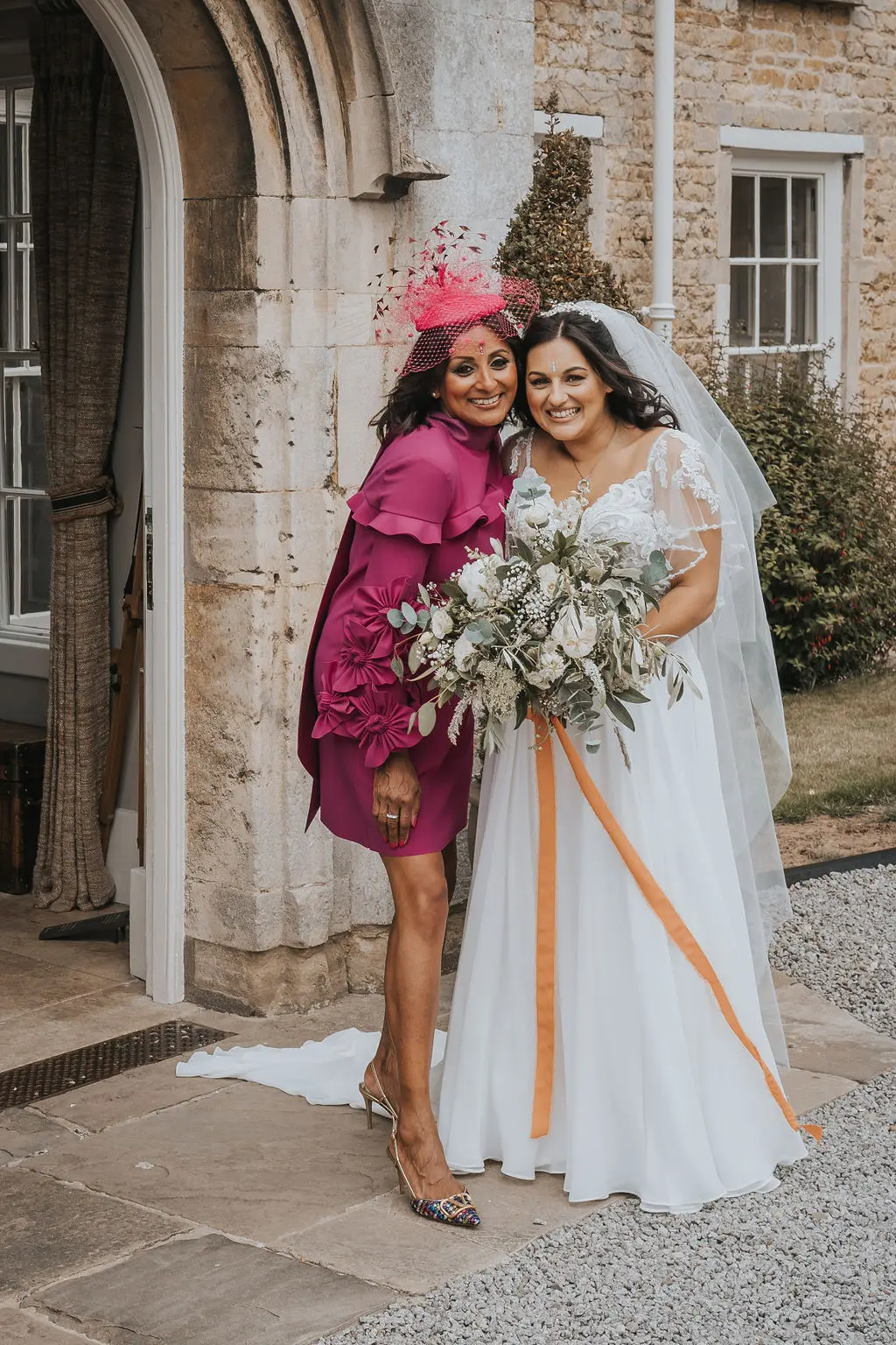 Bride wearing Lorraine by Rebecca Ingram with her friend