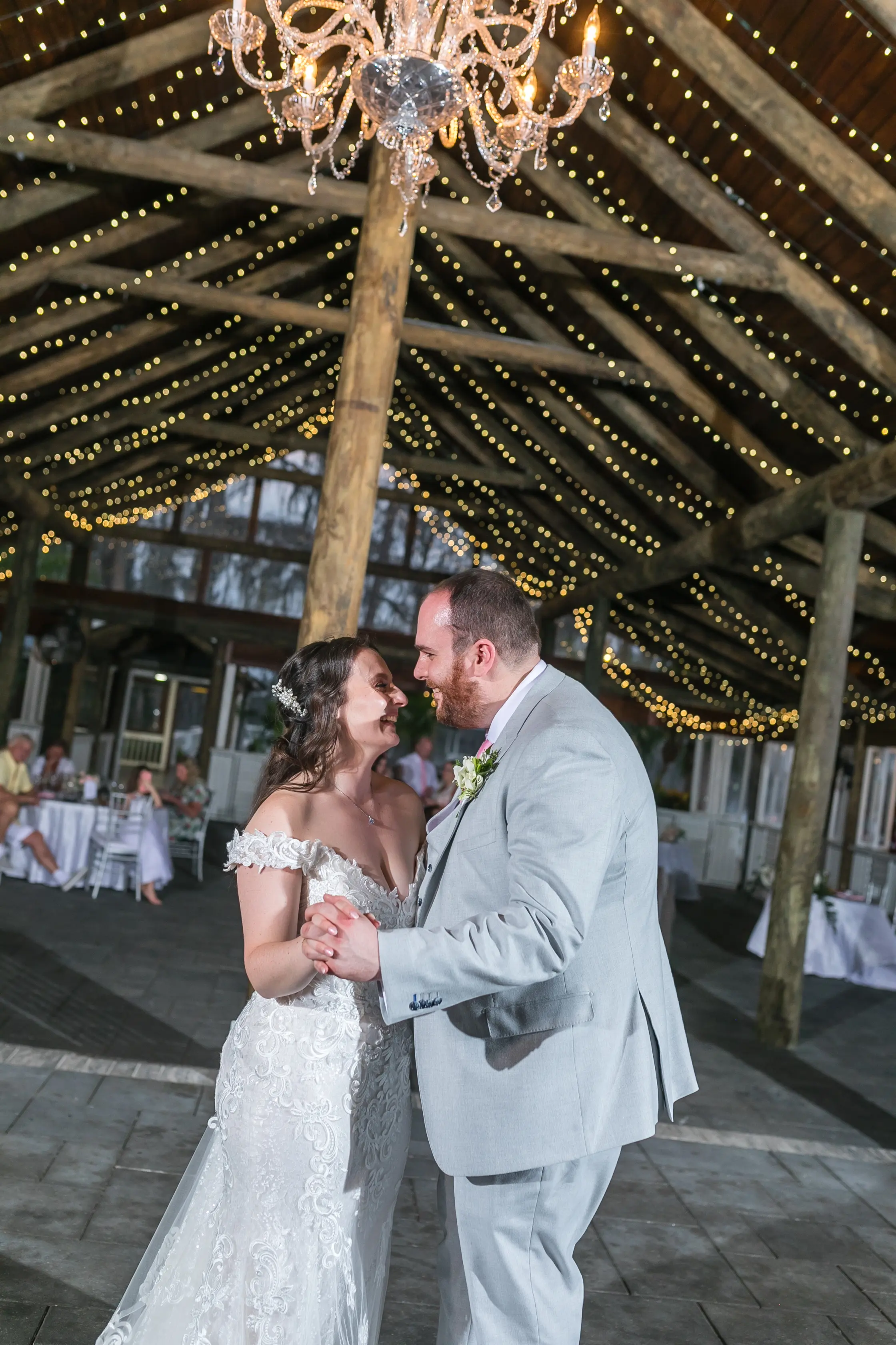 Bride In Off The Shoulder Lace Wedding Dress Called Edison By Maggie Sottero With Groom