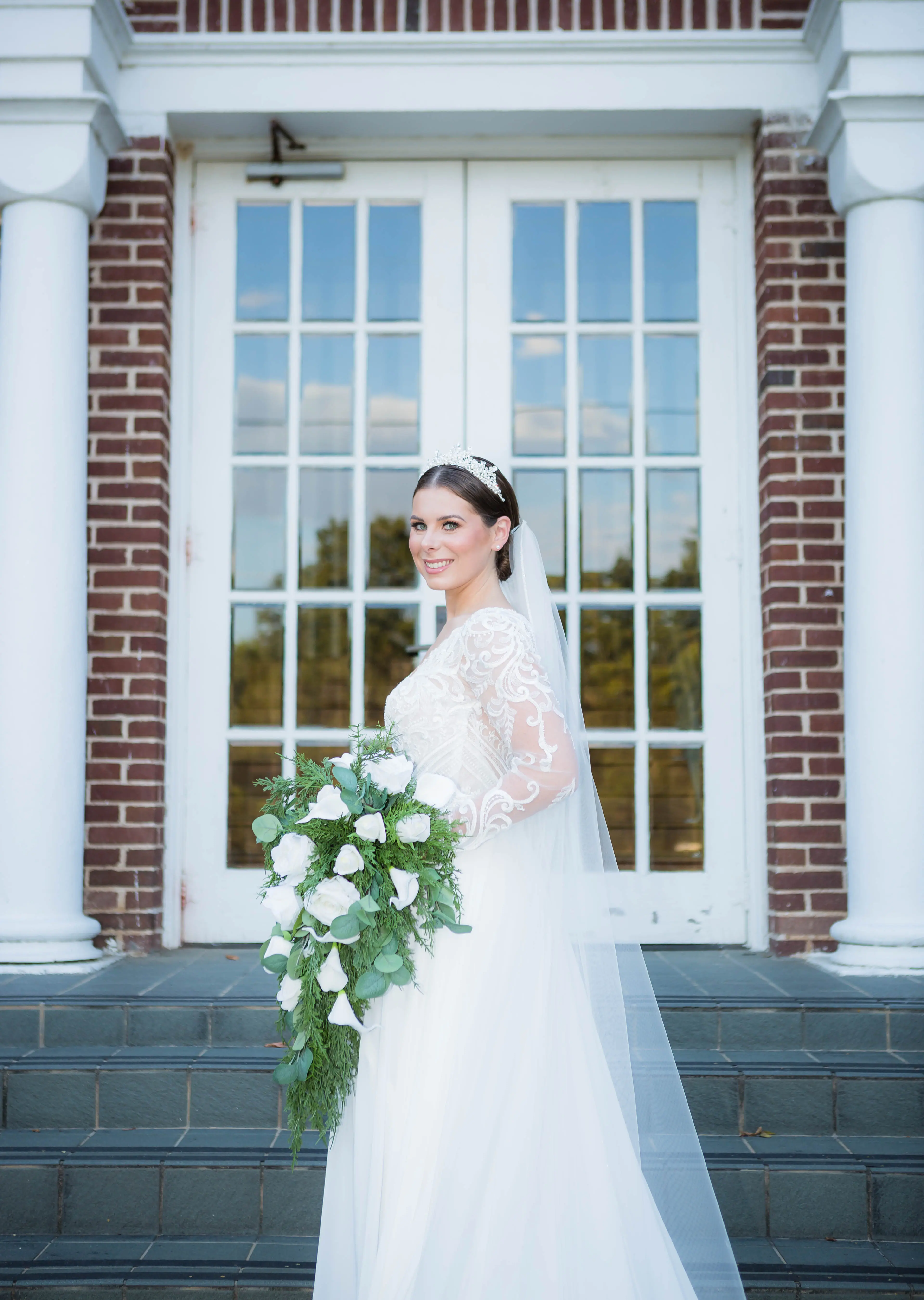 Bride wearing Lorraine Dawn wedding dress by Rebecca Ingram