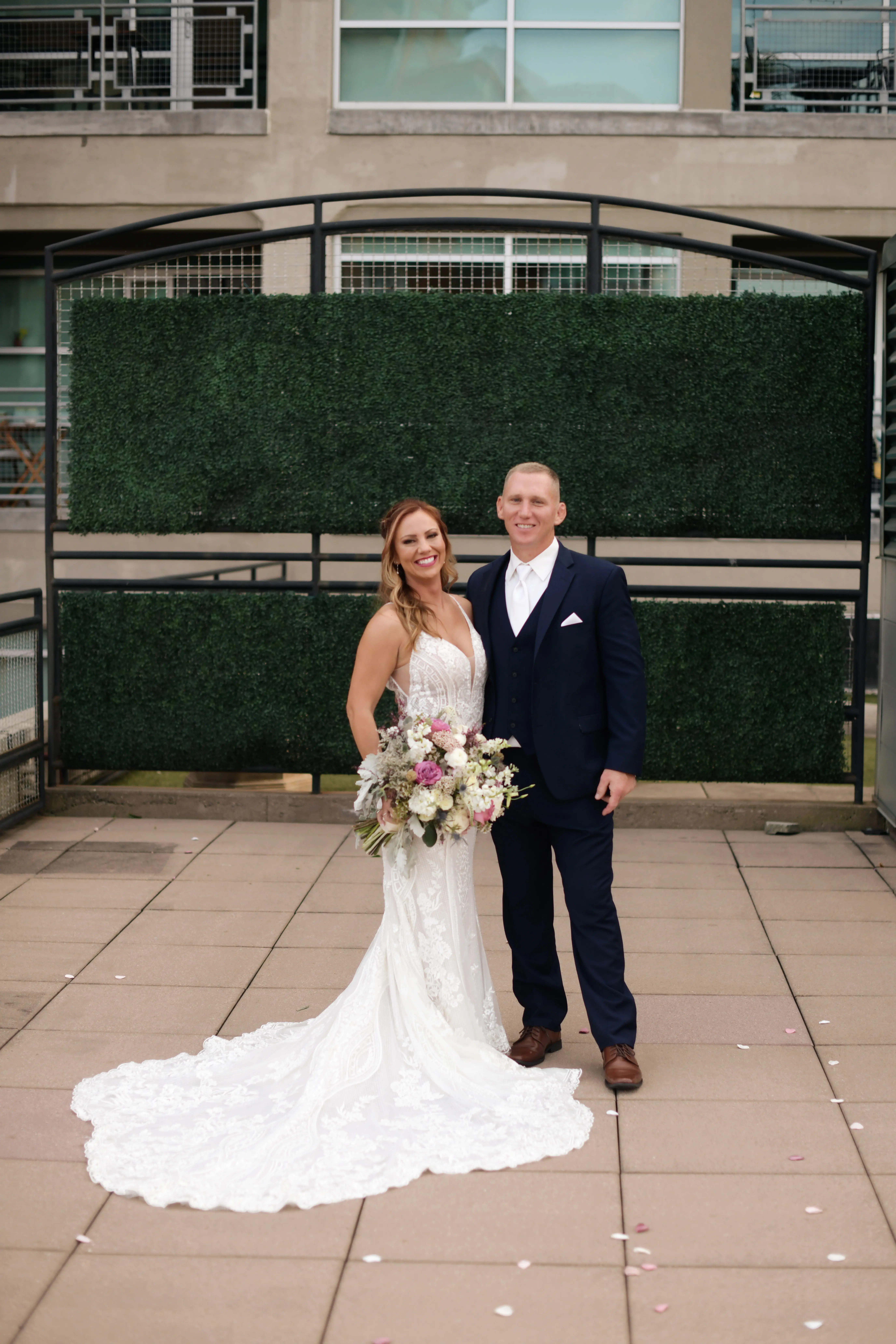 Groom with Bride in V-Neckline Wedding Gown Accented with Beaded Detail Called Bailey by Sottero & Midgley