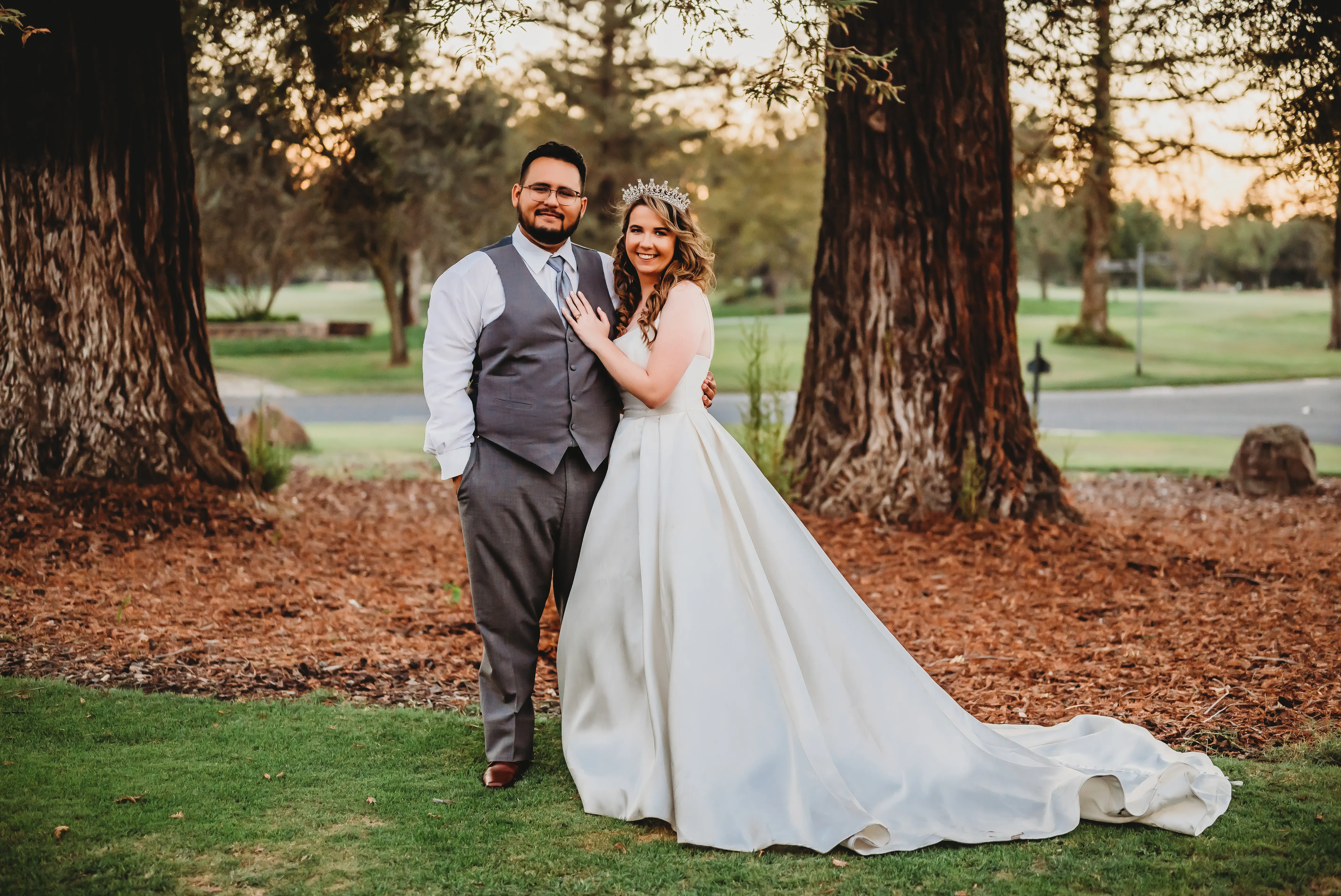 Bride And Groom Standing Together. Bride In Satin A-Line Wedding Dress Called Selena By Maggie Sottero