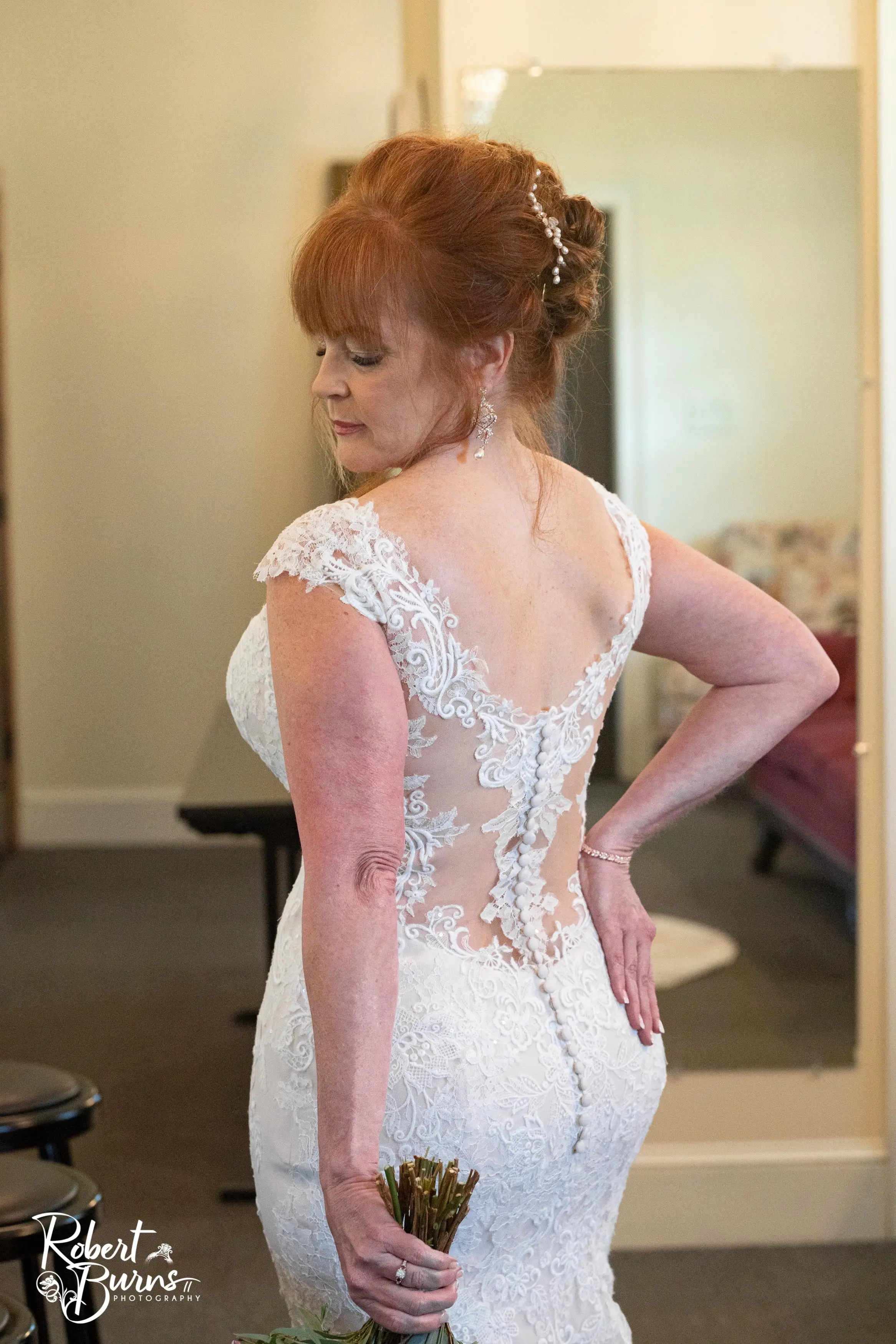 Bride Getting Ready Wearing a Lace Bridal Dress Called Daphne Lynette by Rebecca Ingram
