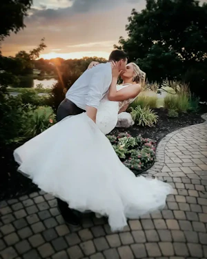Groom With Bride Wearing Trumpet Wedding Dress With Colorful Floral Lace Motifs Kenleigh By Sottero And Midgley