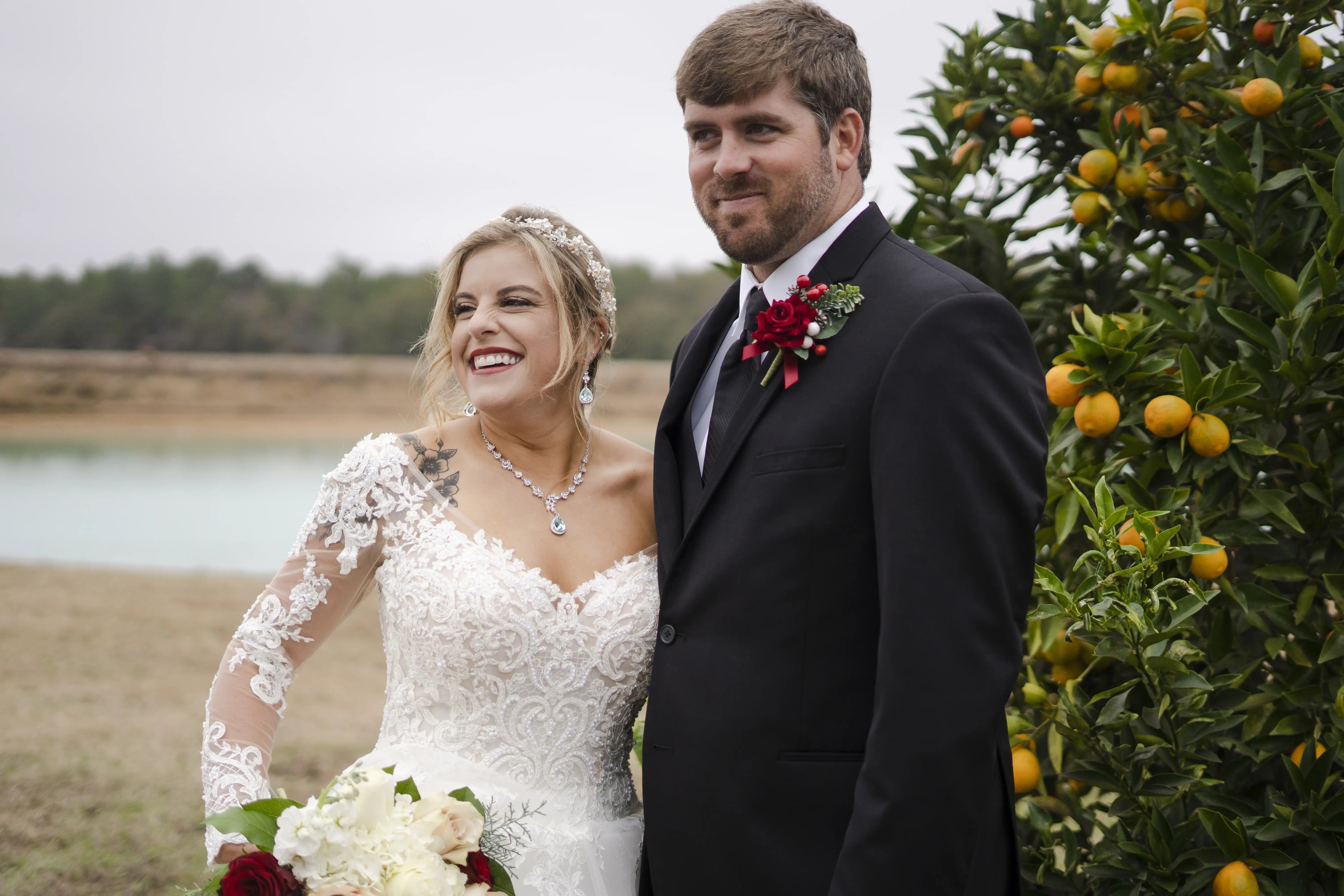 Bride In Off The Shoulder Lace Wedding Dress Called Tiffany By Maggie Sottero With Groom