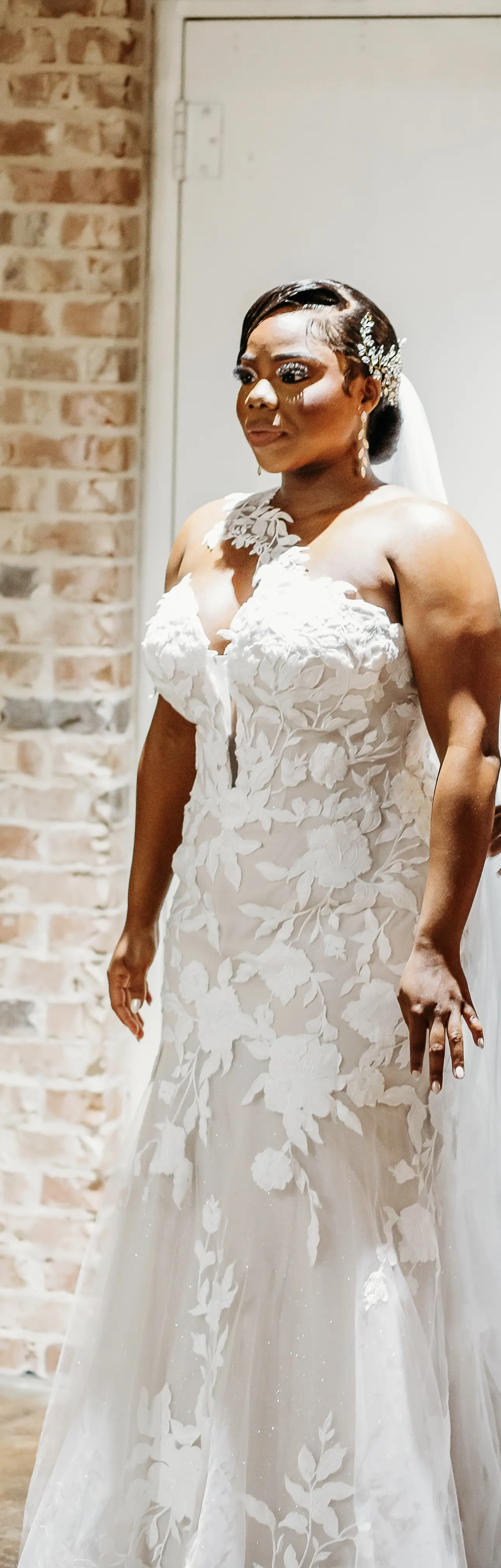 Bride wearing Hattie by Rebecca Ingram getting ready