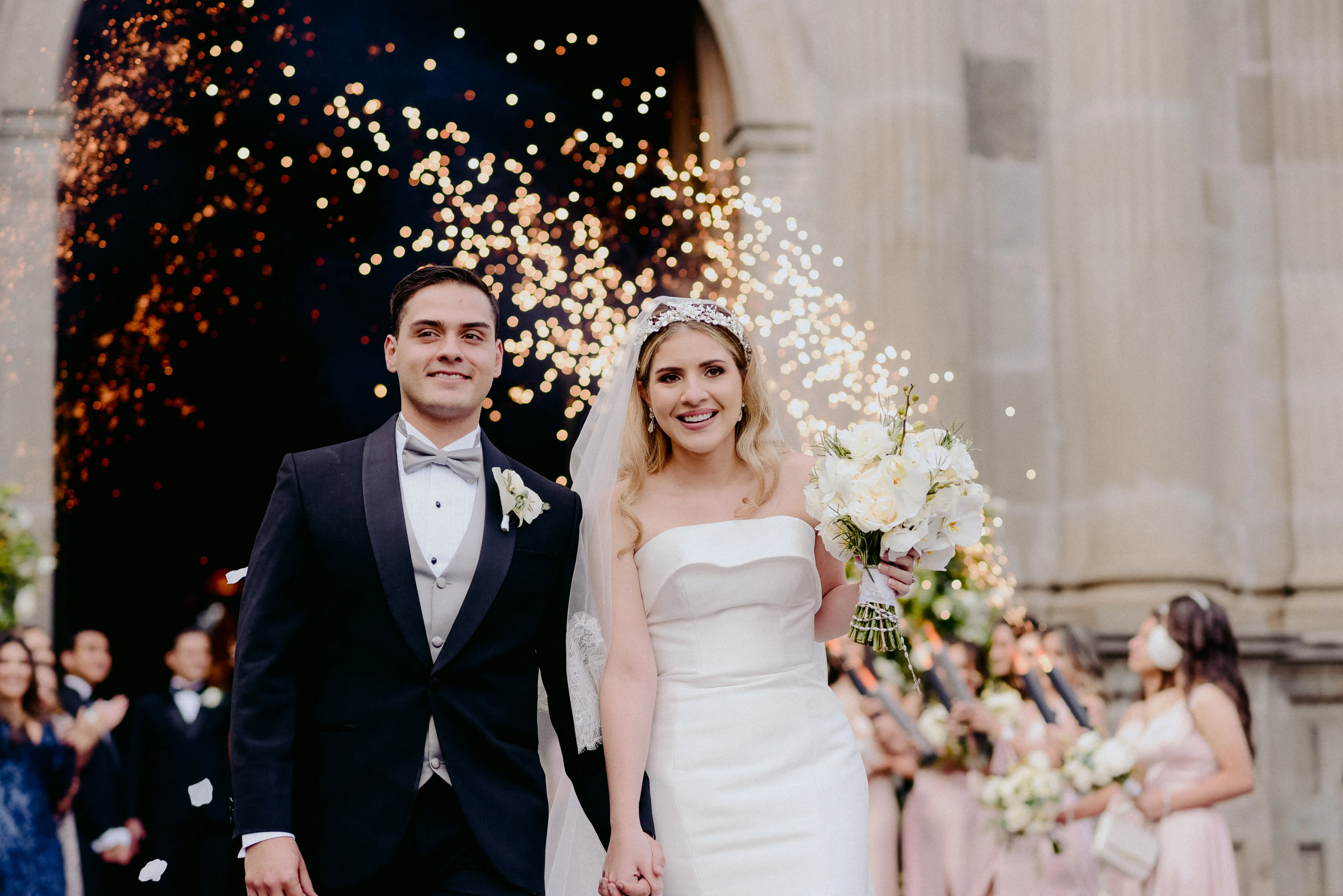 Bride Holding Groom's Hand and Bouquet Wearing Wedding Dress Called Mitchell by Maggie Sottero