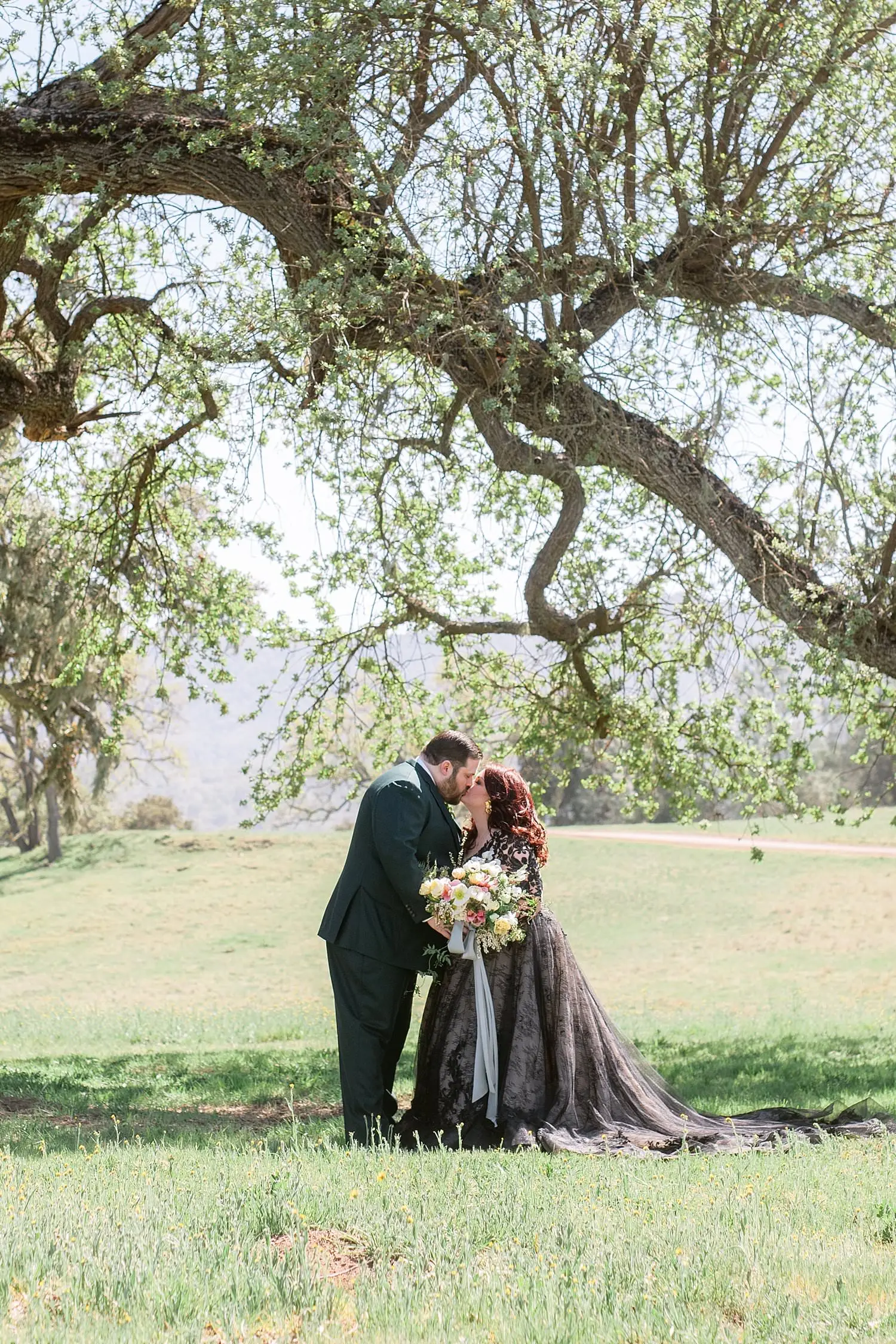 Newlyweds kissing.