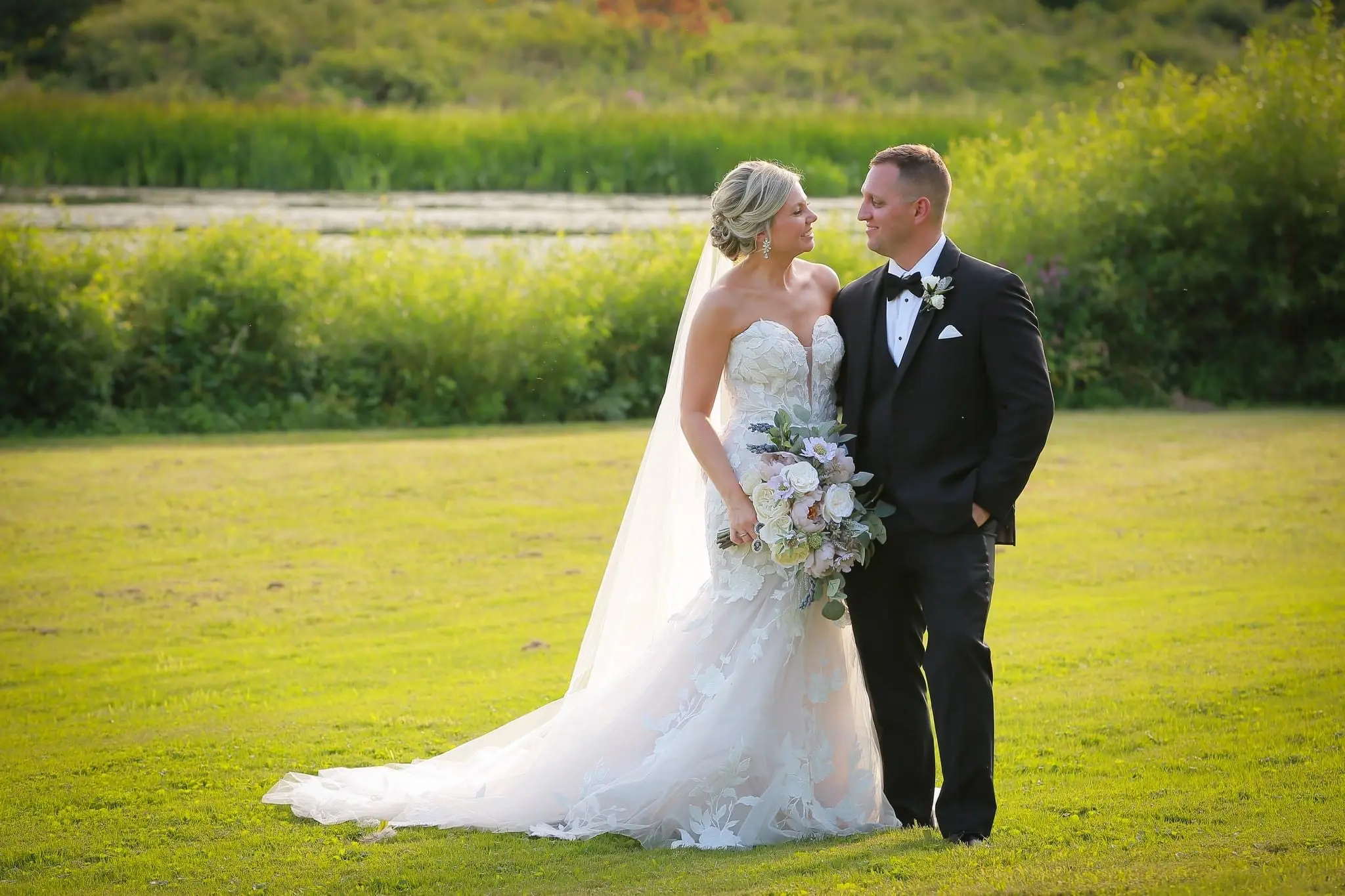 Groom With Bride Wearing Mermaid Wedding Dress With Oversized Floral Lace Hattie By Rebecca Ingram