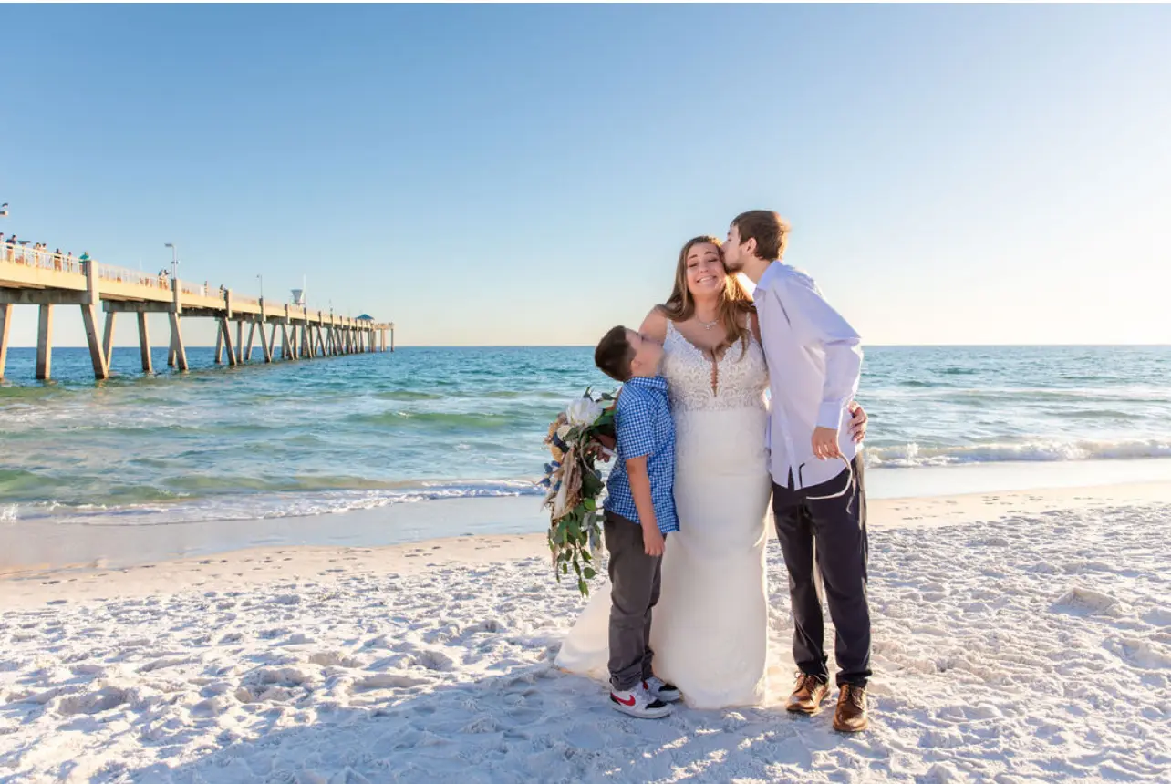 Bride wearing Johanna Lane wedding dress by Maggie Sottero with her family