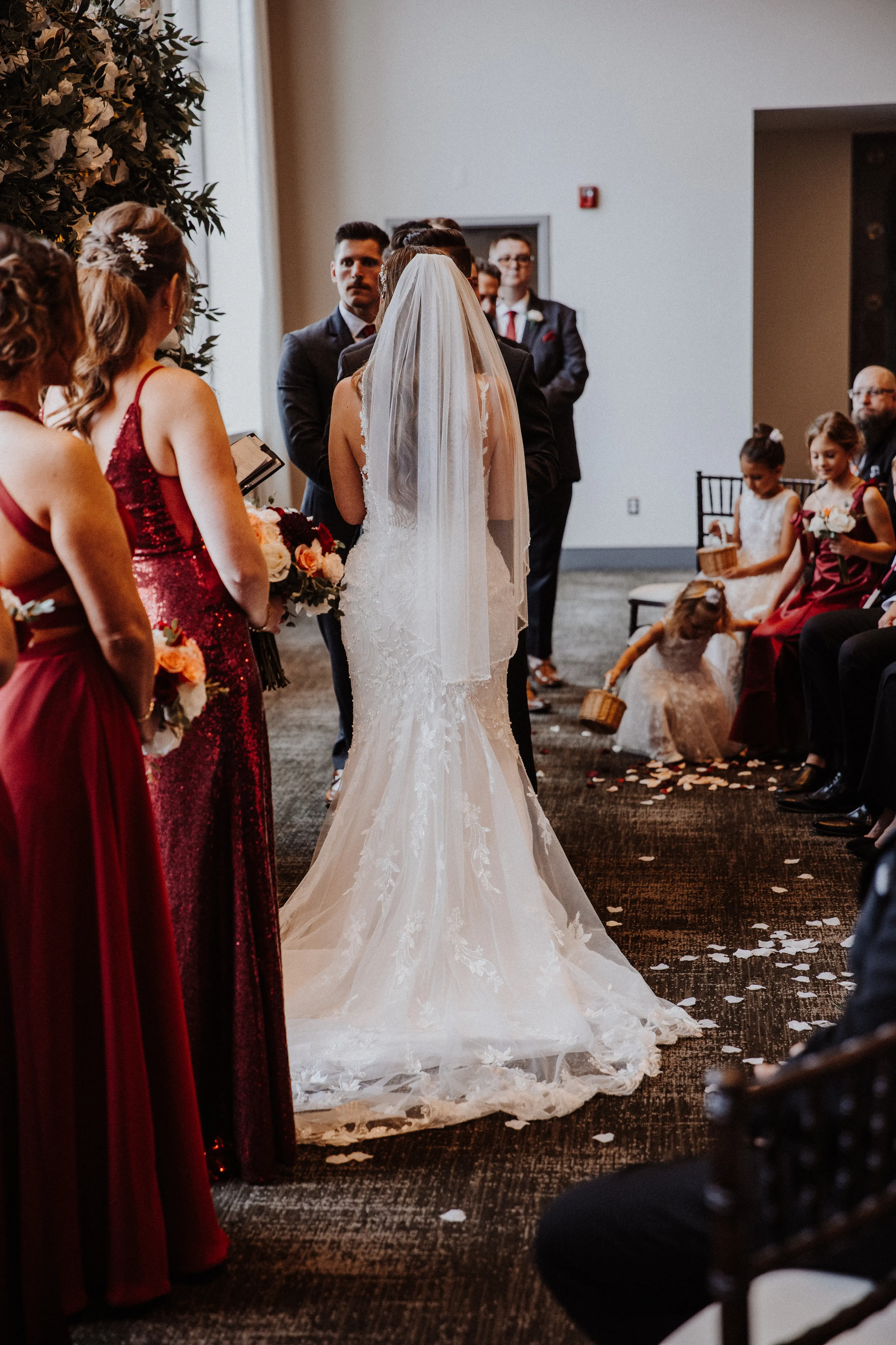 Bride Wearing Beaded Fit-n-flare Wedding Dress Called Jonah Lane By Sottero And Midgley With Groom At The Altar