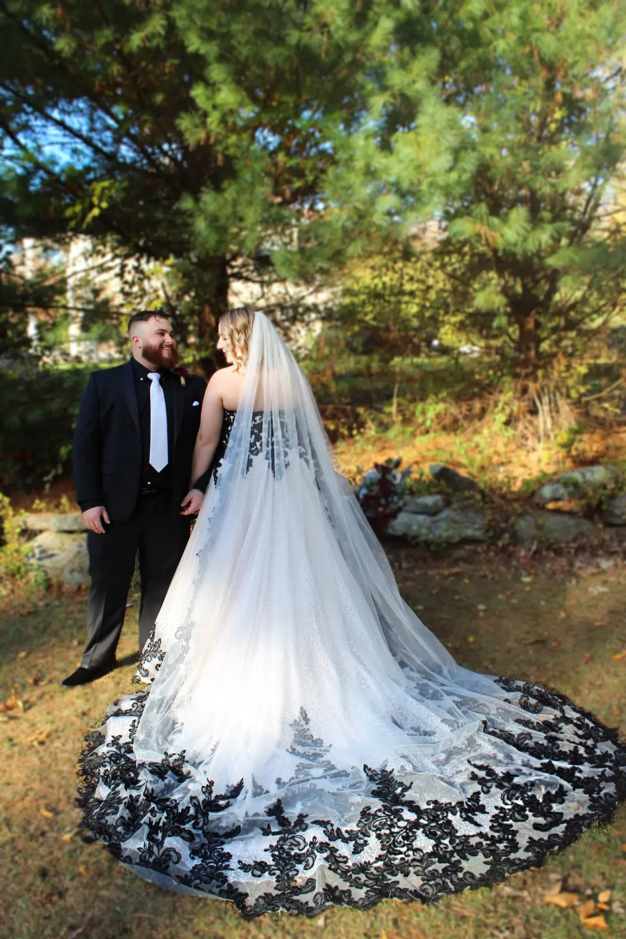Bride Wearing Black Lace Wedding Dress Called Tristyn By Maggie Sottero and Black Lace Wedding Veil With Groom