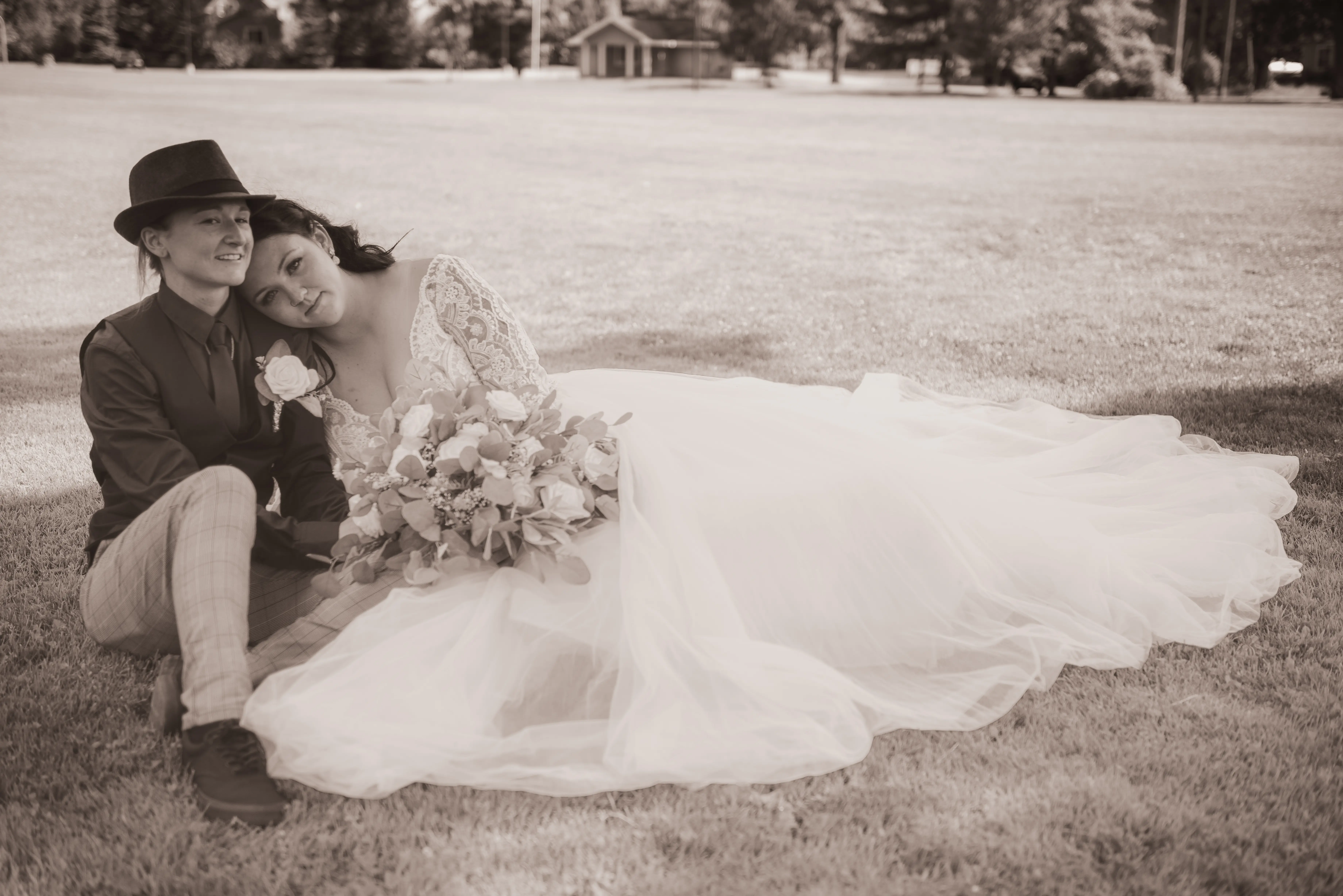 Real Bride in V-neckline, Tulle Skirt Wedding Dress Named Mallory Dawn by Maggie Sottero with Groom