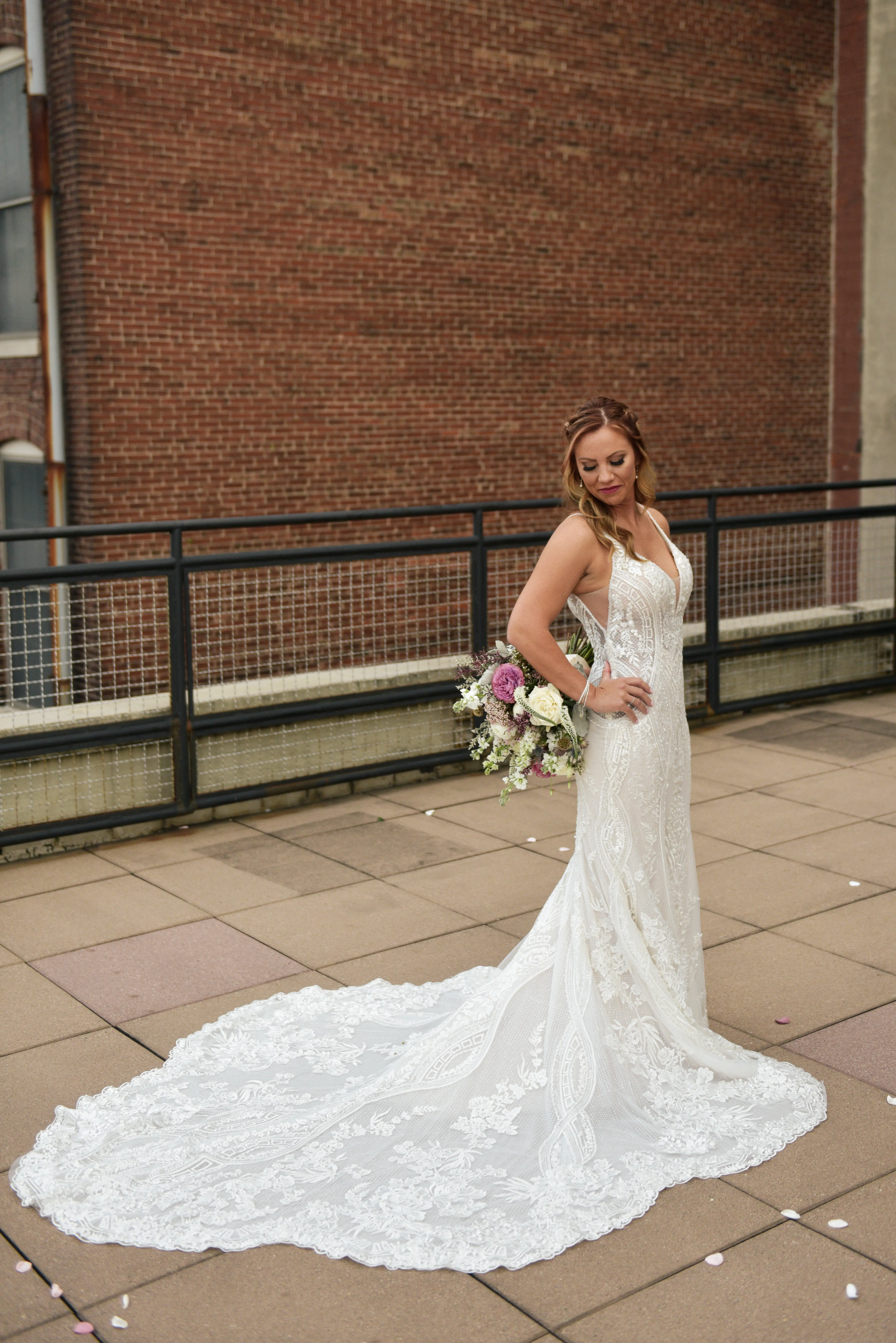 Bride in V-Neckline Wedding Gown Accented with Beaded Detail Called Bailey by Sottero & Midgley