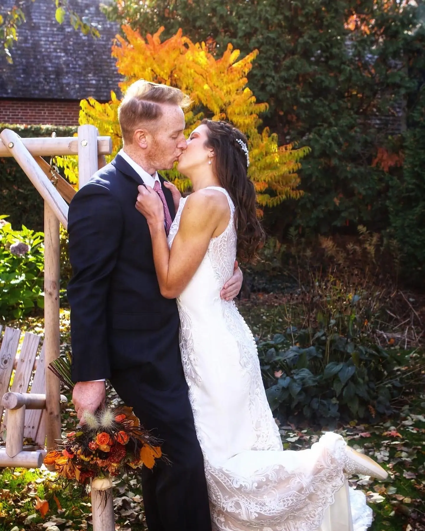Real Bride in Halter Fit-and-Flare Crepe Wedding Dress with Layers of Sheer Lace and Lace Motifs Called Kevyn by Sottero & Midgley