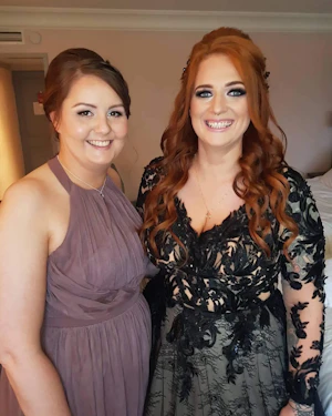 Bride wearing Zander Black Wedding Dress Called Zander by Sottero and Midgley with her Bridesmaid