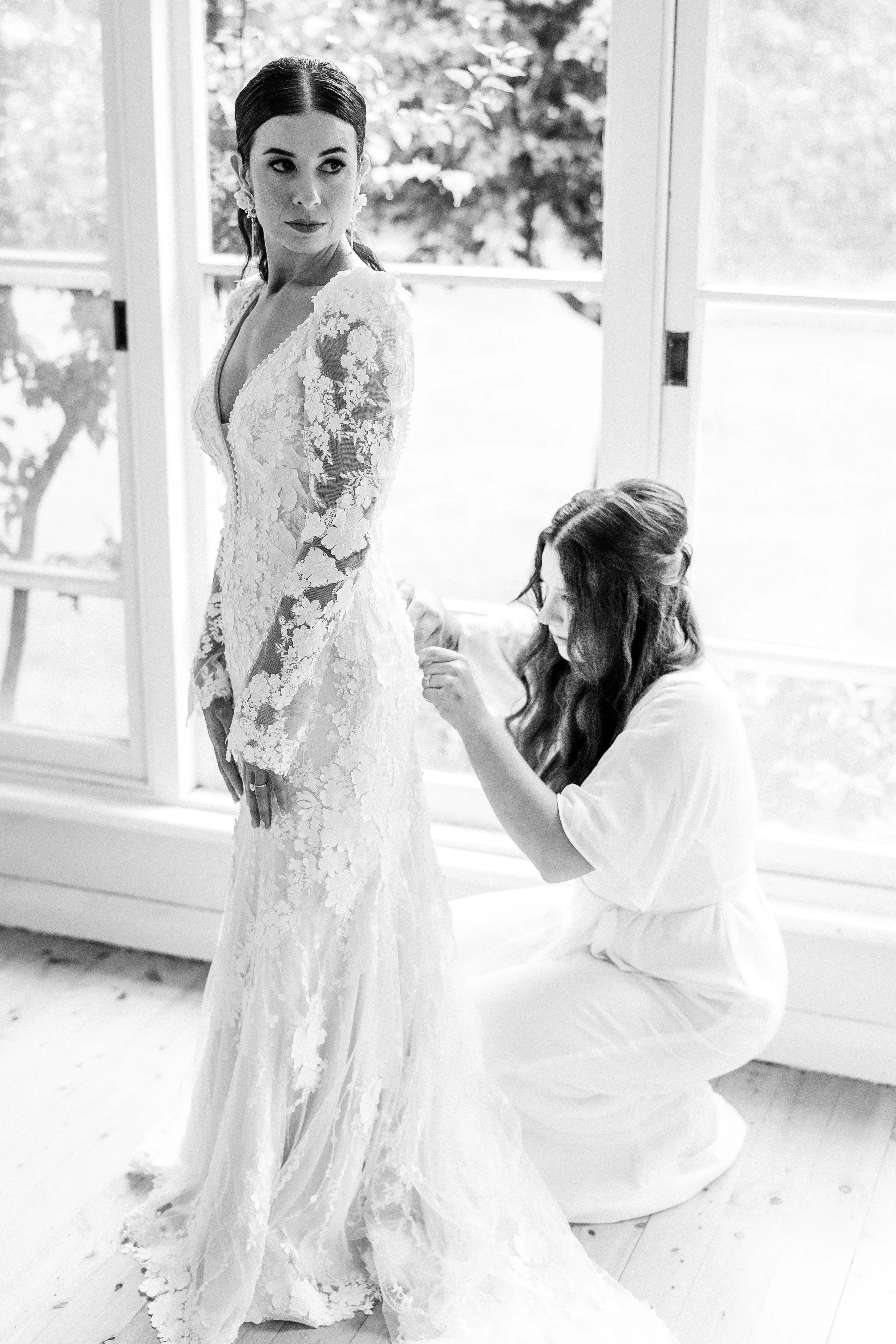 Real Bride wearing puff sleeve wedding dress with 3D floral details called Cruz by Sottero and Midgley..