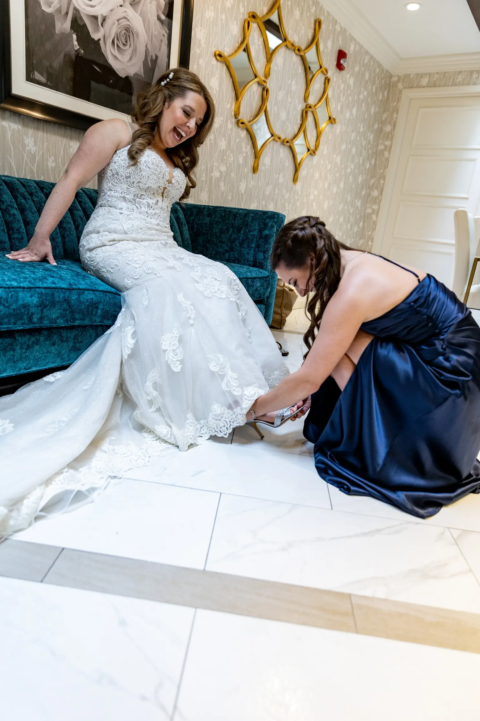 Bride Wearing Lace Fit-And-Flare Wedding Dress Called Fiona By Maggie Sottero Getting Her Shoes On