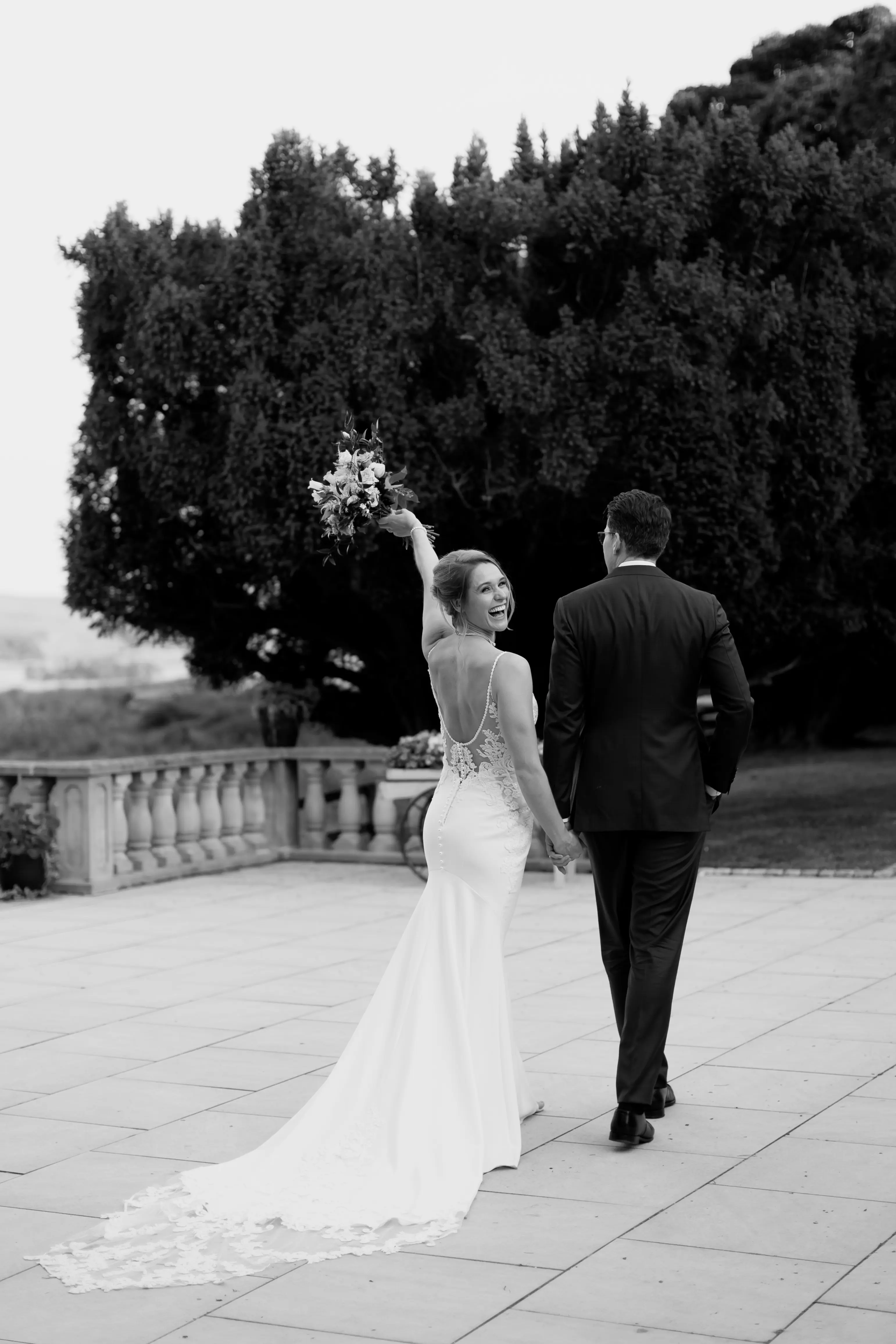Bride Wearing Lace Mermaid Wedding Dress Called Nikki By Maggie Sottero Walking With Groom