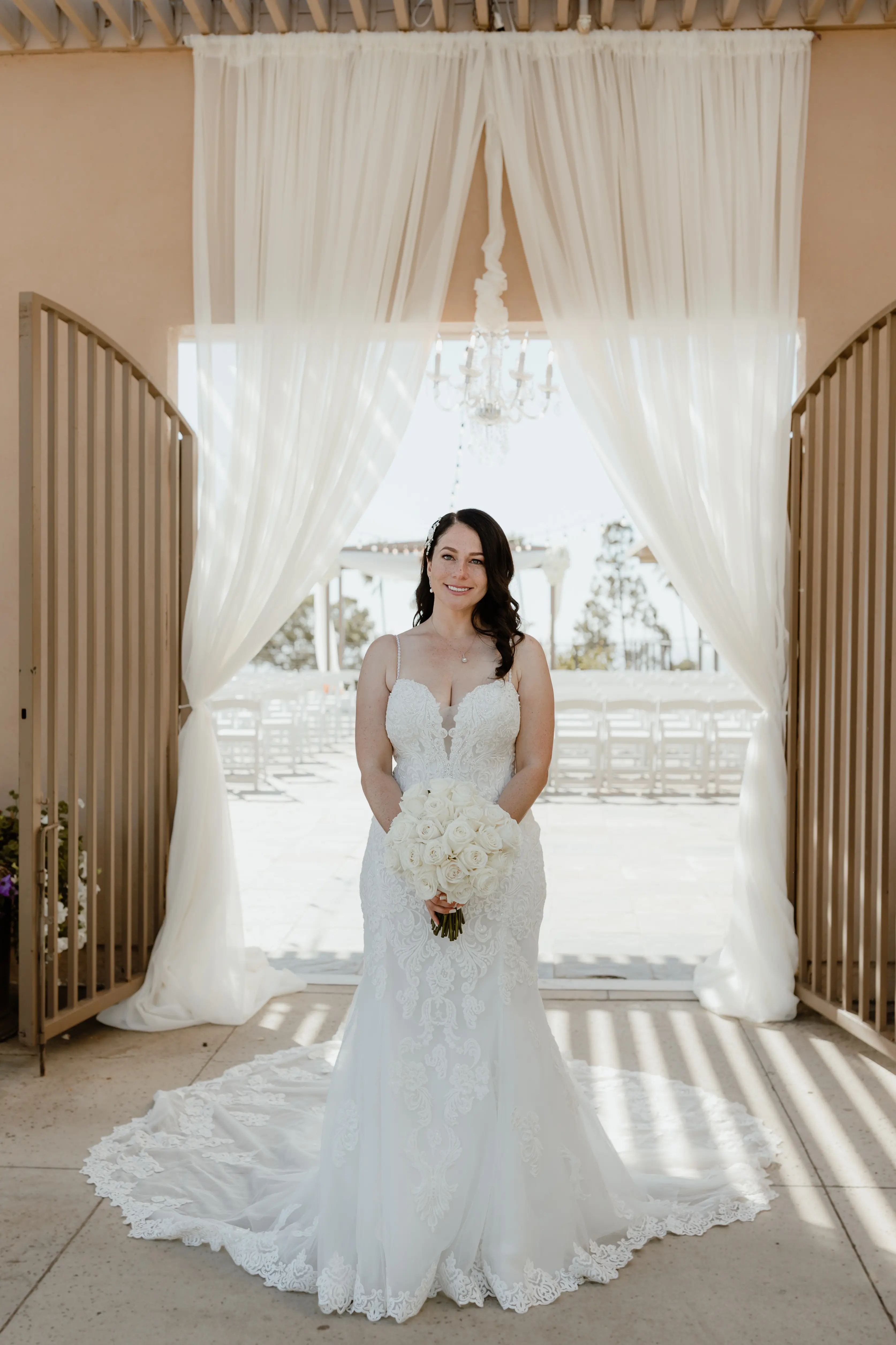 Bride In Sexy Fit-And-Flare Wedding Dress Called Fiona By Maggie Sottero With Bouquet