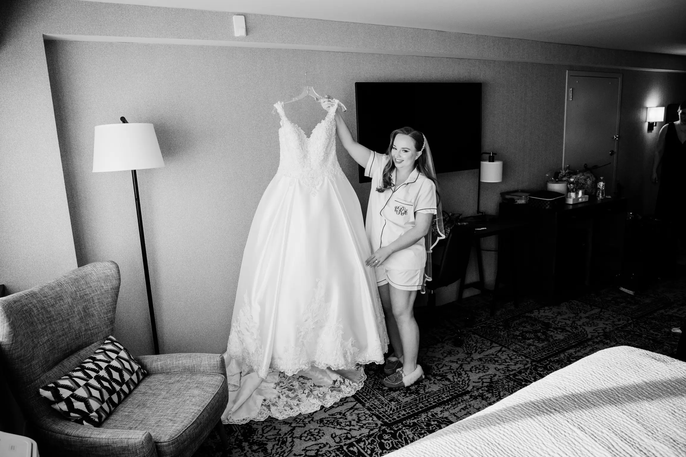 Bride Getting Ready Holding Her Satin Sparkly Ball Gown Called Kimora By Sottero And Midgley